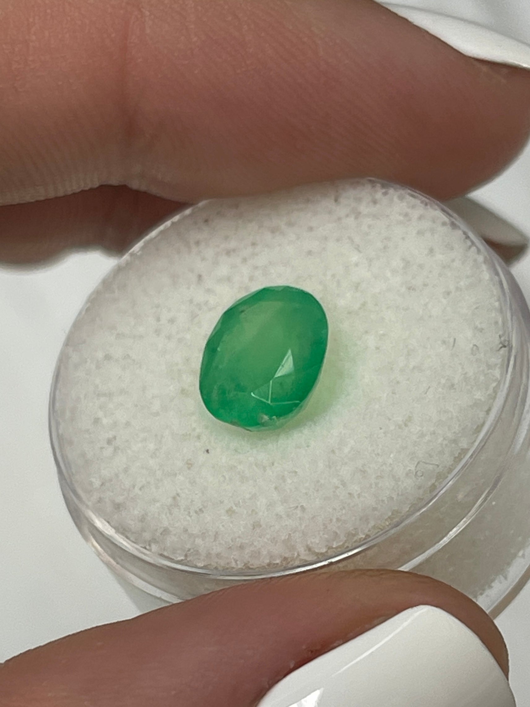 2.52 carat mossy yellowish green natural Colombian emerald loose oval-cut gemstone from JR Colombian Emeralds.