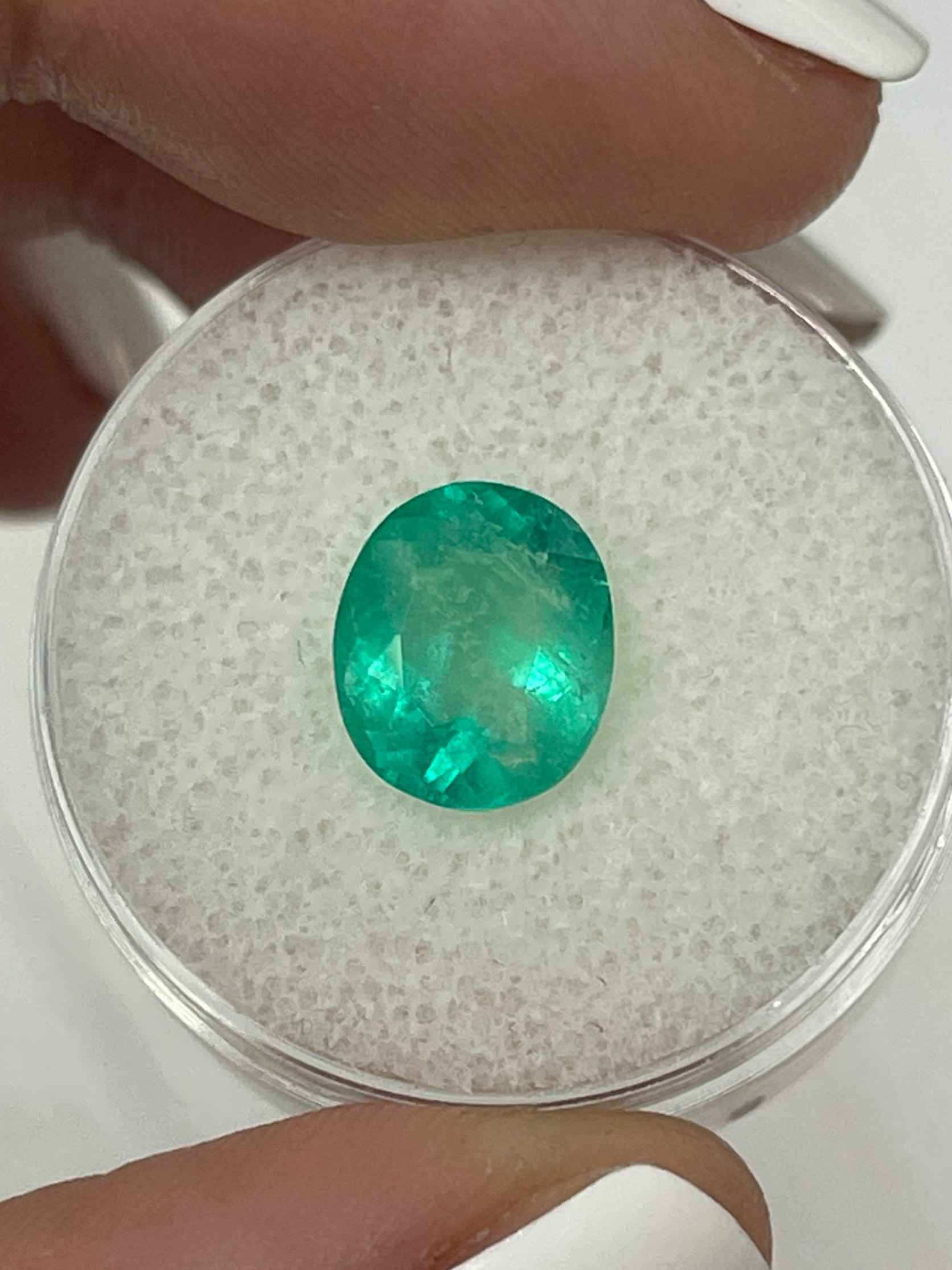 2.53 carat green natural Colombian emerald loose oval cut gemstone, showcasing vibrant color and clarity.