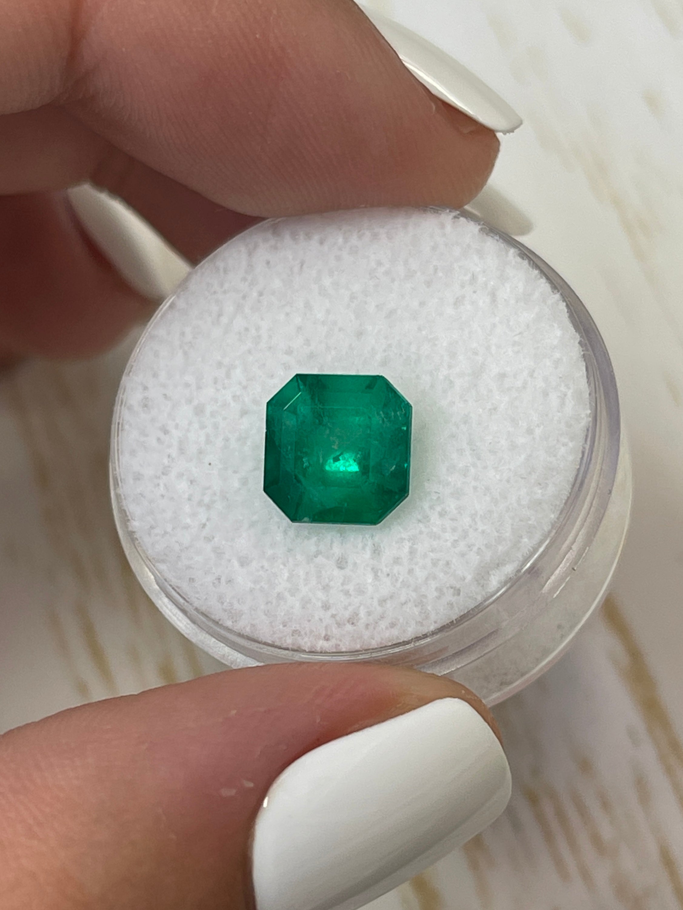 2.55-carat forest green Muzo Colombian emerald in Asscher cut, natural loose gemstone with vibrant green color.
