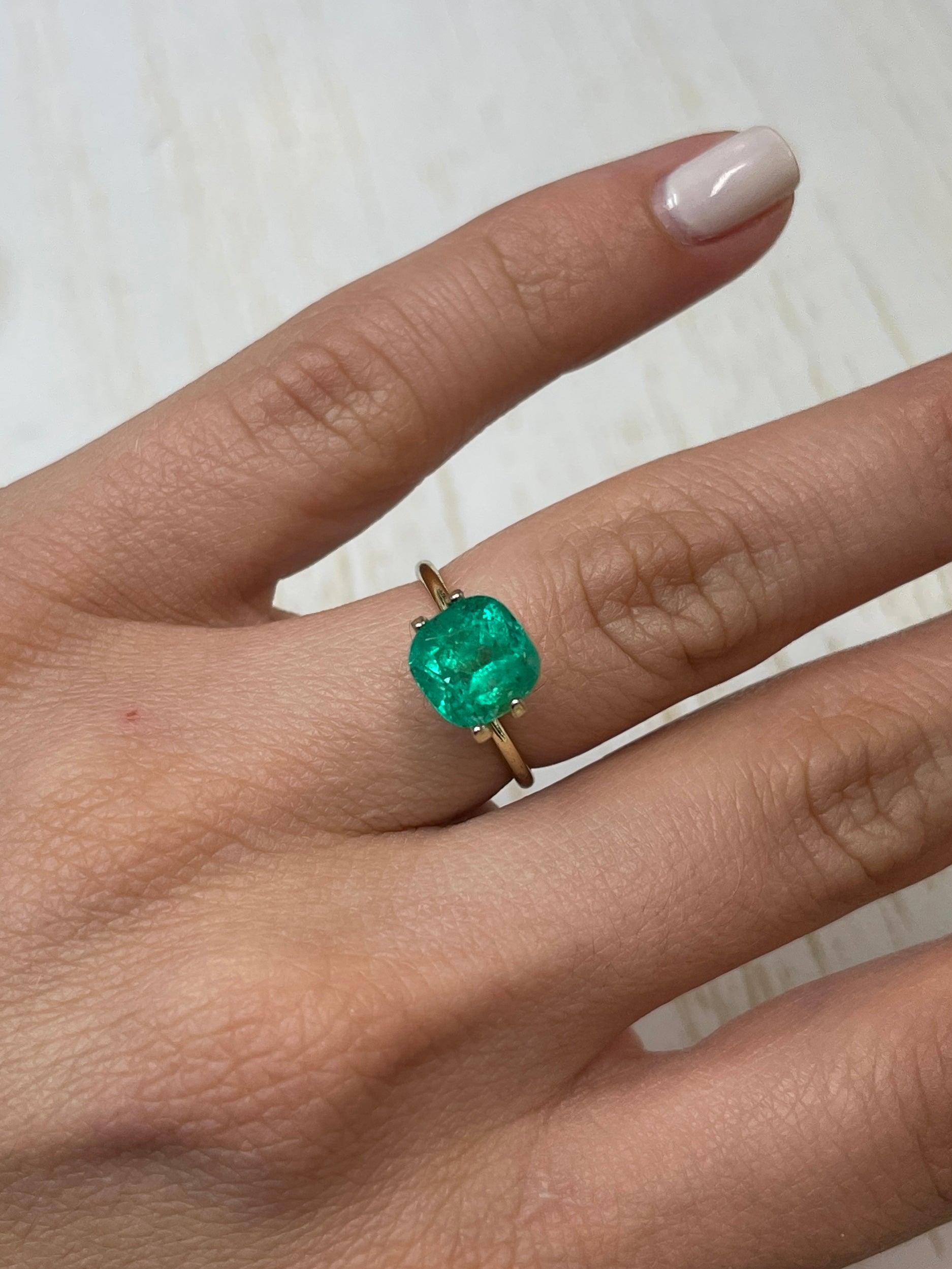 Natural 2.63 Carat Colombian Emerald loose cushion cut gemstone from JR Colombian Emeralds, showcasing vibrant green color and clarity.