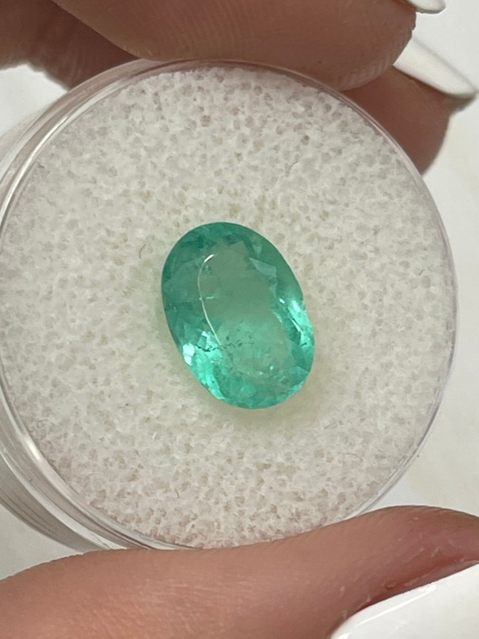 Light bluish green 2.63 carat Colombian emerald loose gemstone in oval cut by JR Colombian Emeralds.