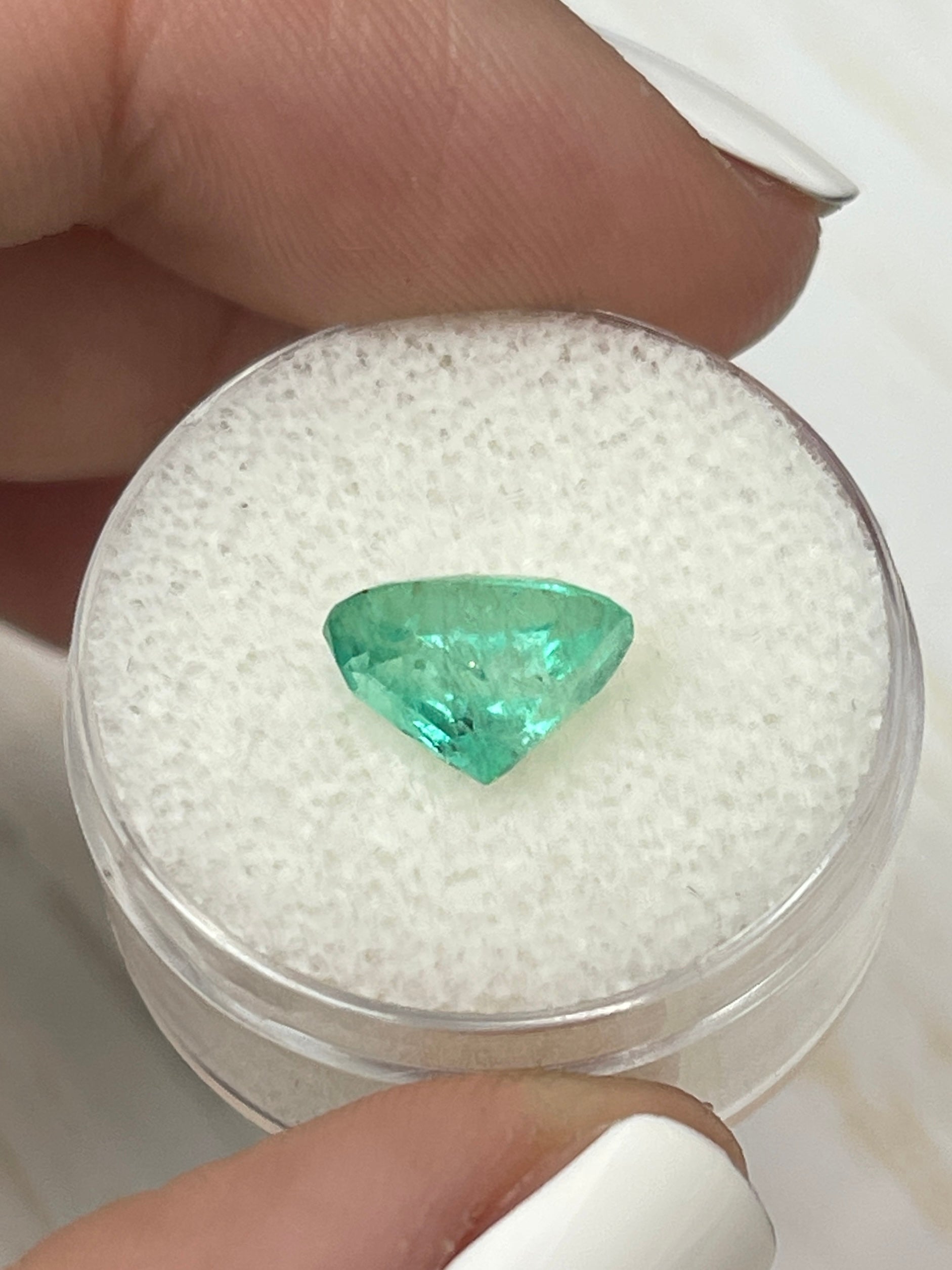 2.75 carat lightly freckled green Colombian emerald in oval cut, loose gemstone from JR Colombian Emeralds.