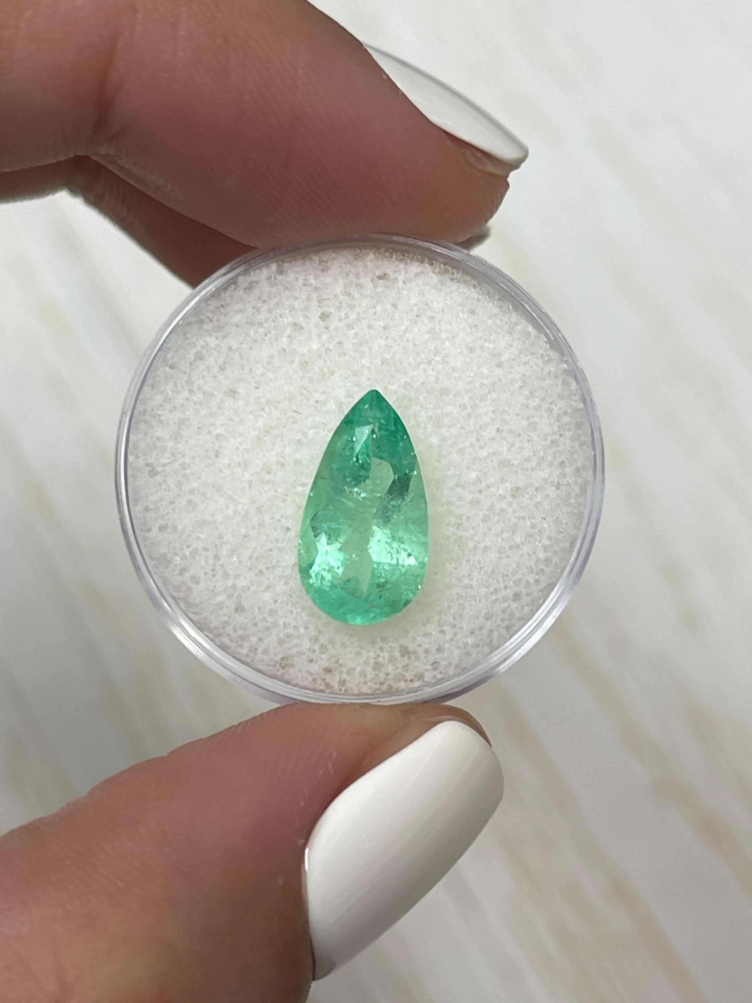 2.76 carat elongated pear cut natural Colombian emerald by JR Colombian Emeralds, showcasing rich green color and clarity.