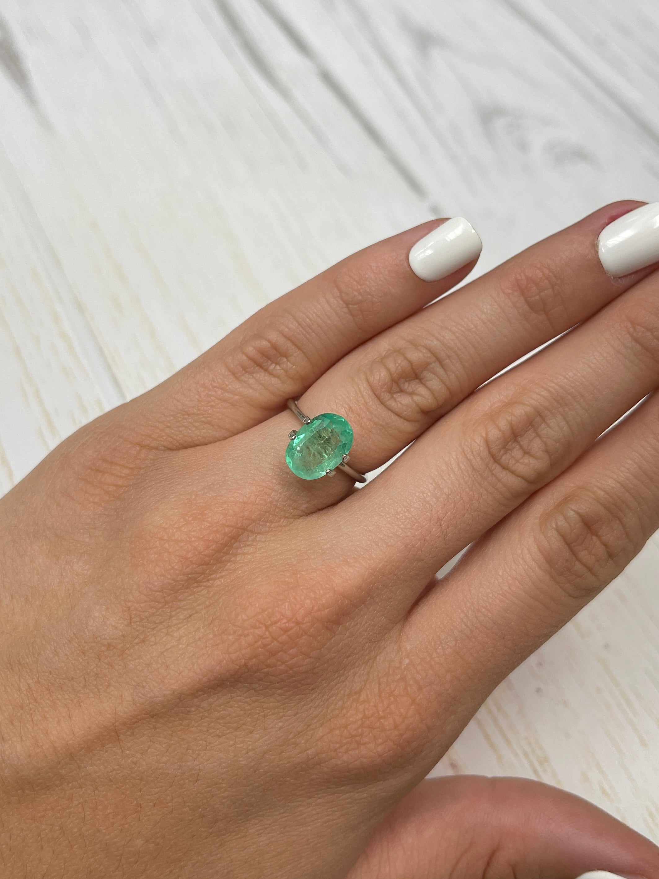 Light yellowish green 2.78 carat natural Colombian emerald in oval cut, loose gemstone from JR Colombian Emeralds.