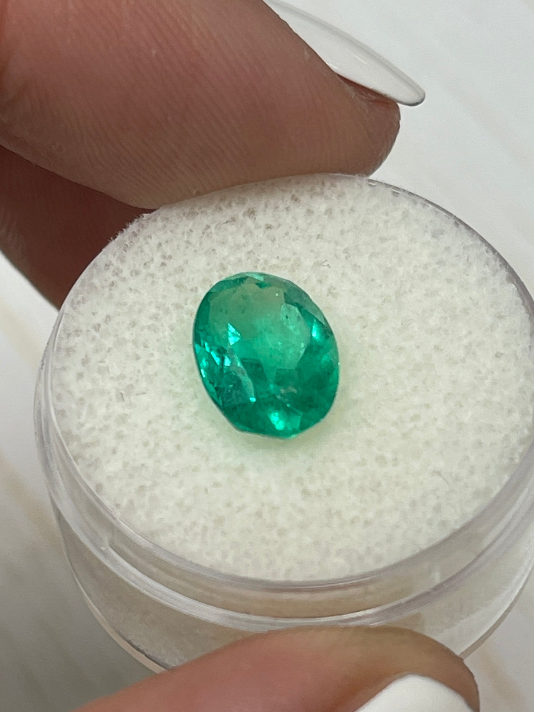 Vibrant green 2.87 carat Colombian emerald loose oval cut gemstone with an elongated 11x8mm shape, from JR Colombian Emeralds.