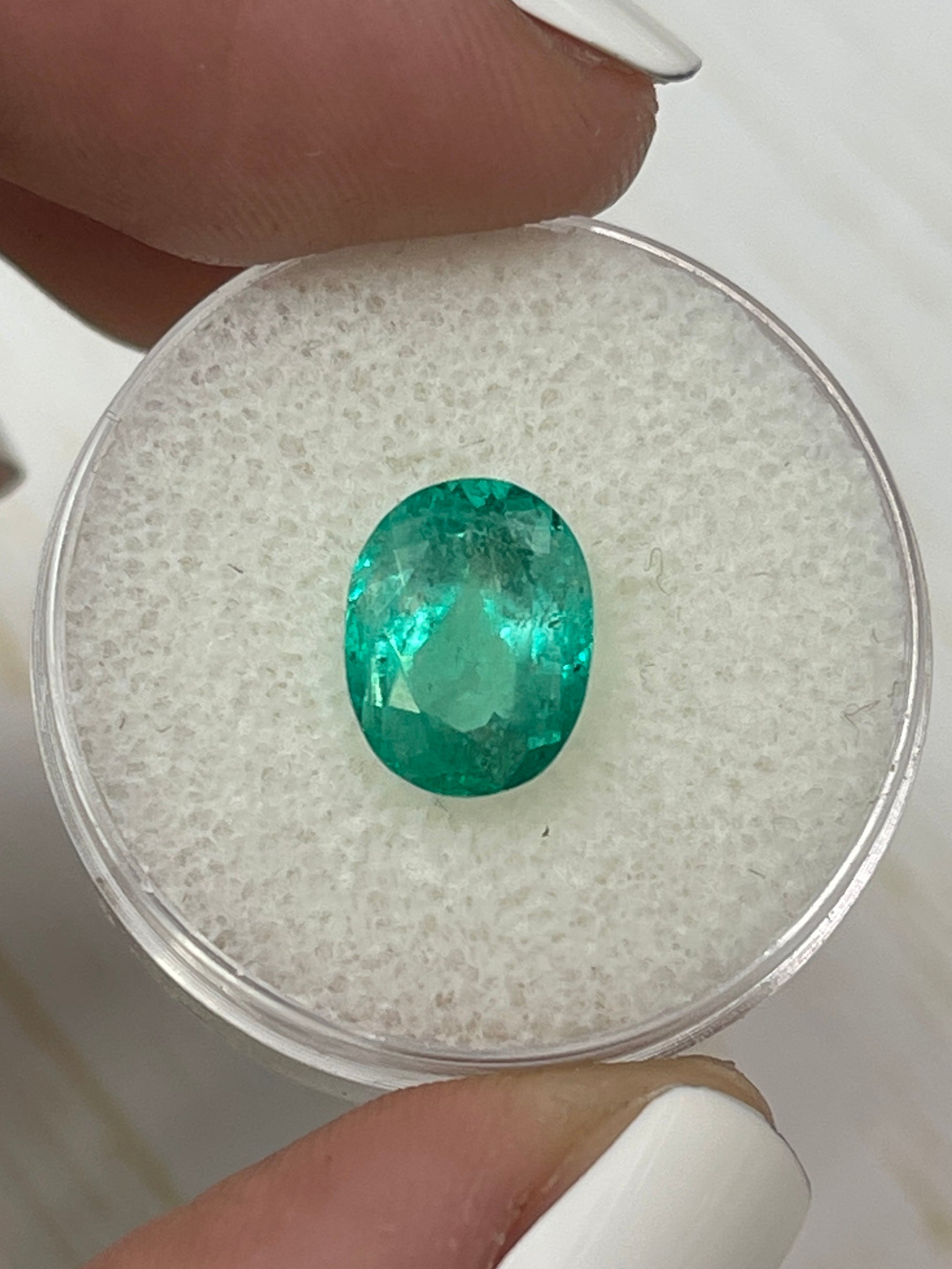 Light bluish green 2.88 carat natural Colombian emerald in oval cut, loose gemstone from JR Colombian Emeralds.