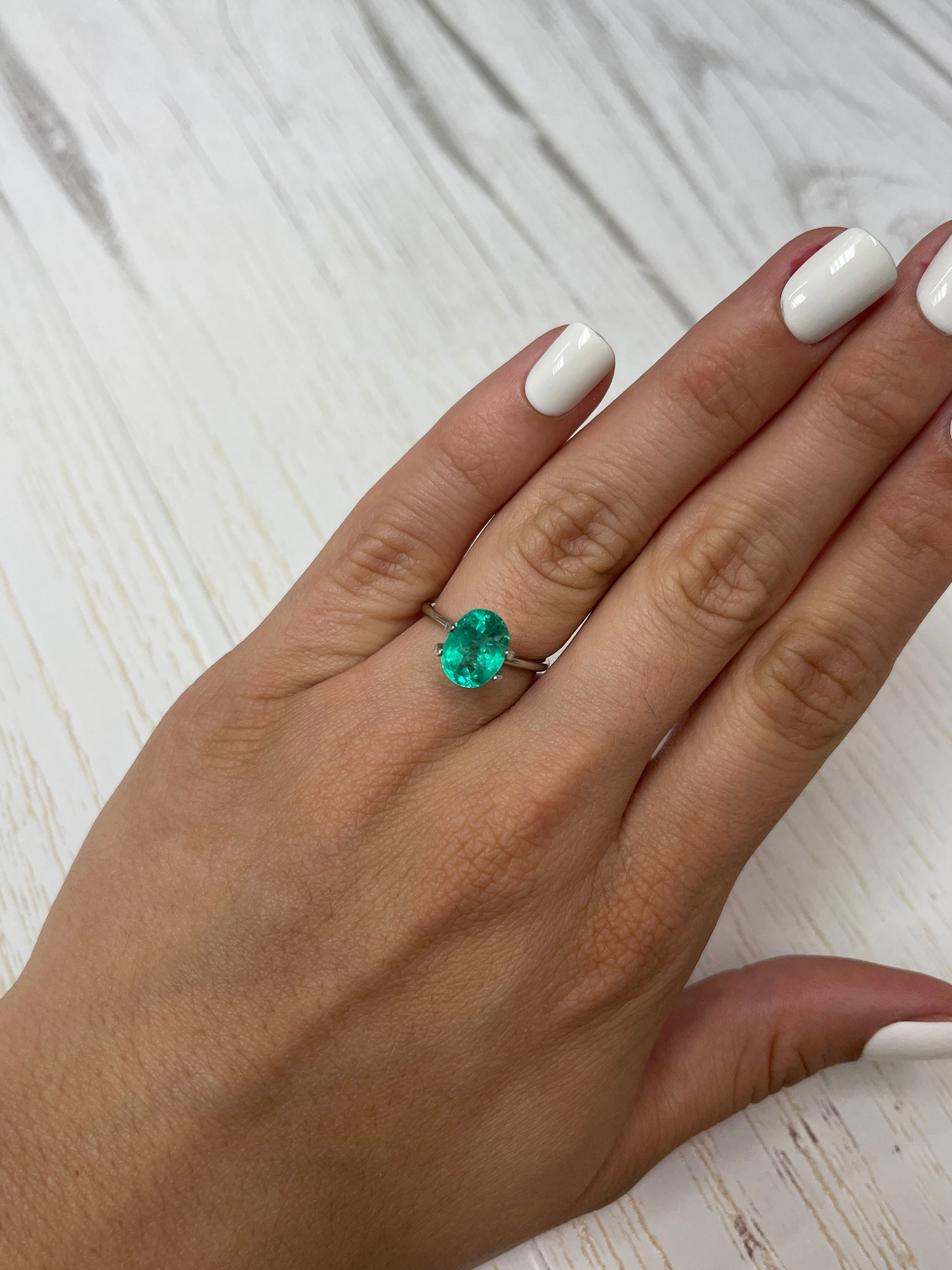 Bluish green 2.90 carat oval cut Colombian emerald from JR Colombian Emeralds, natural loose gemstone with vibrant color.