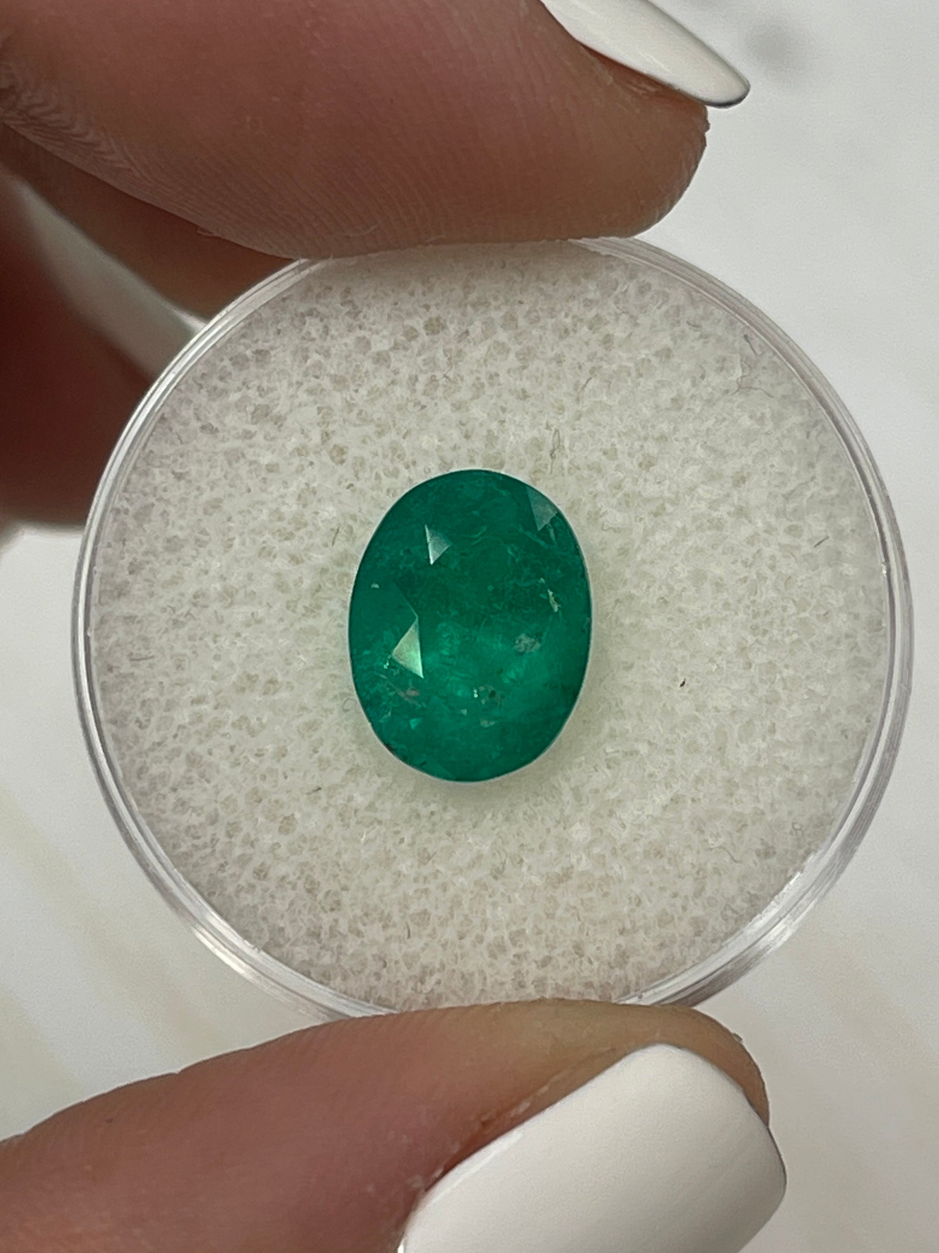 2.98 carat intense dark green Colombian emerald loose oval cut gemstone from JR Colombian Emeralds.