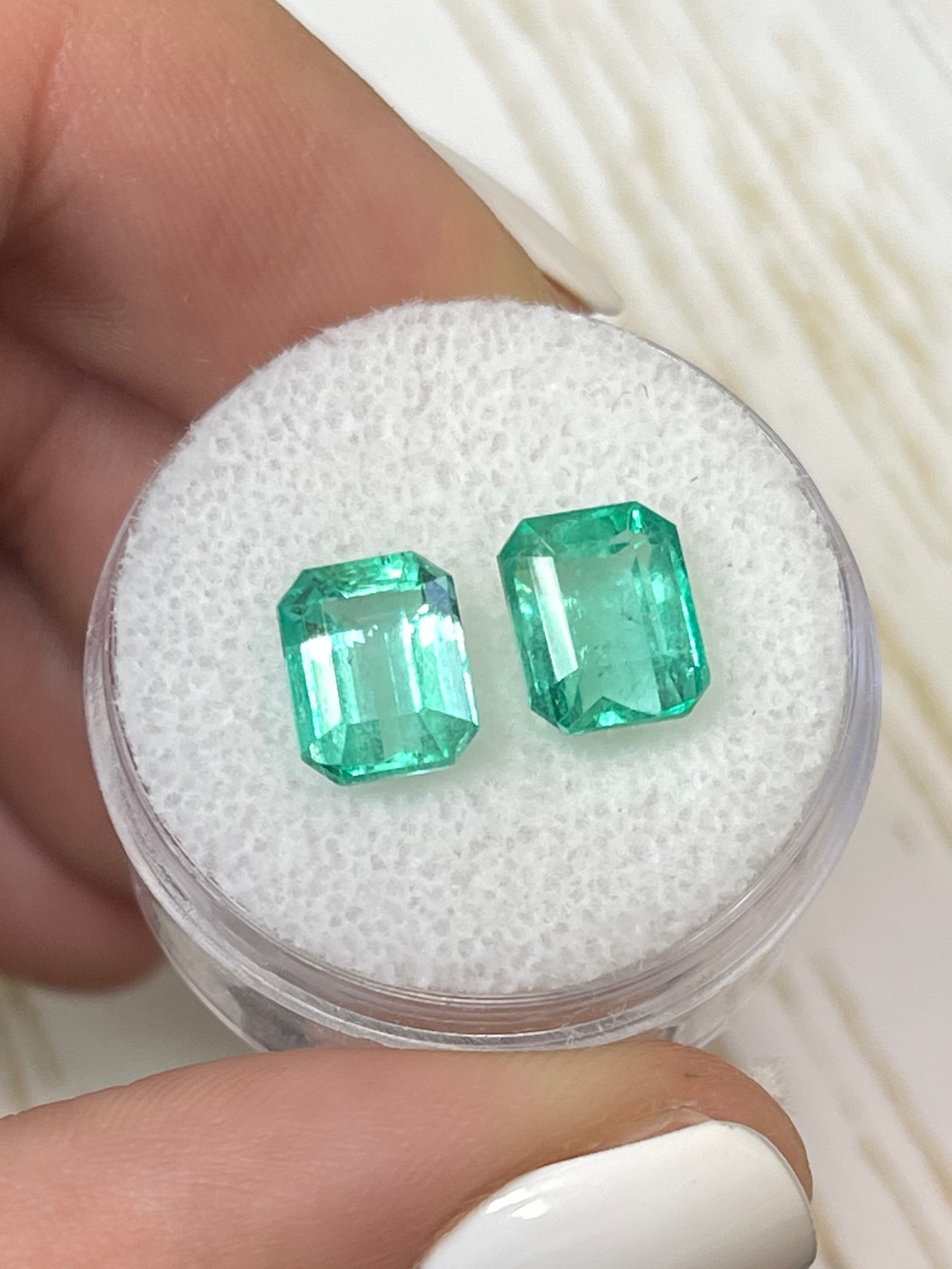 Three 3.03 carat total weight Colombian emeralds in emerald cut, matching green loose gemstones by JR Colombian Emeralds.