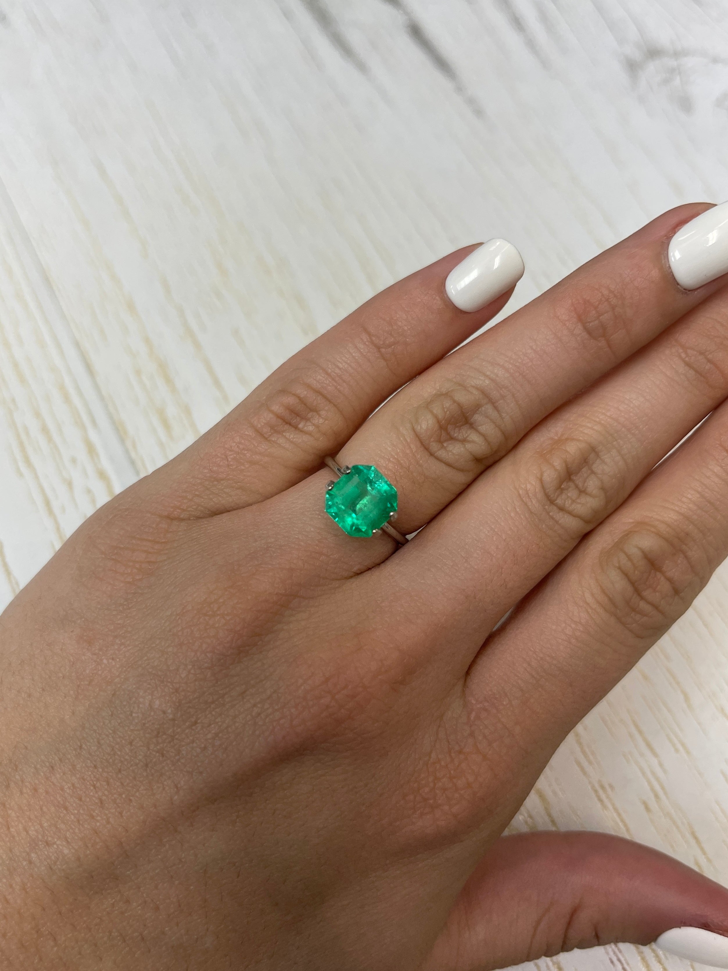 9x9mm yellowish green natural Colombian emerald loose Asscher cut, 3.21 carats, from JR Colombian Emeralds.