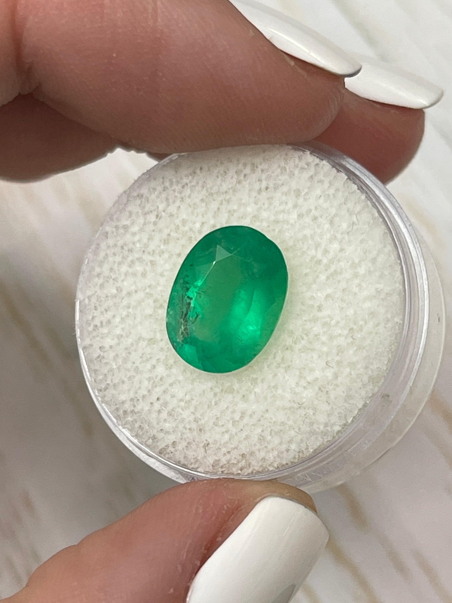 3.46 carat neon green natural Colombian emerald loose oval cut gemstone by JR Colombian Emeralds.