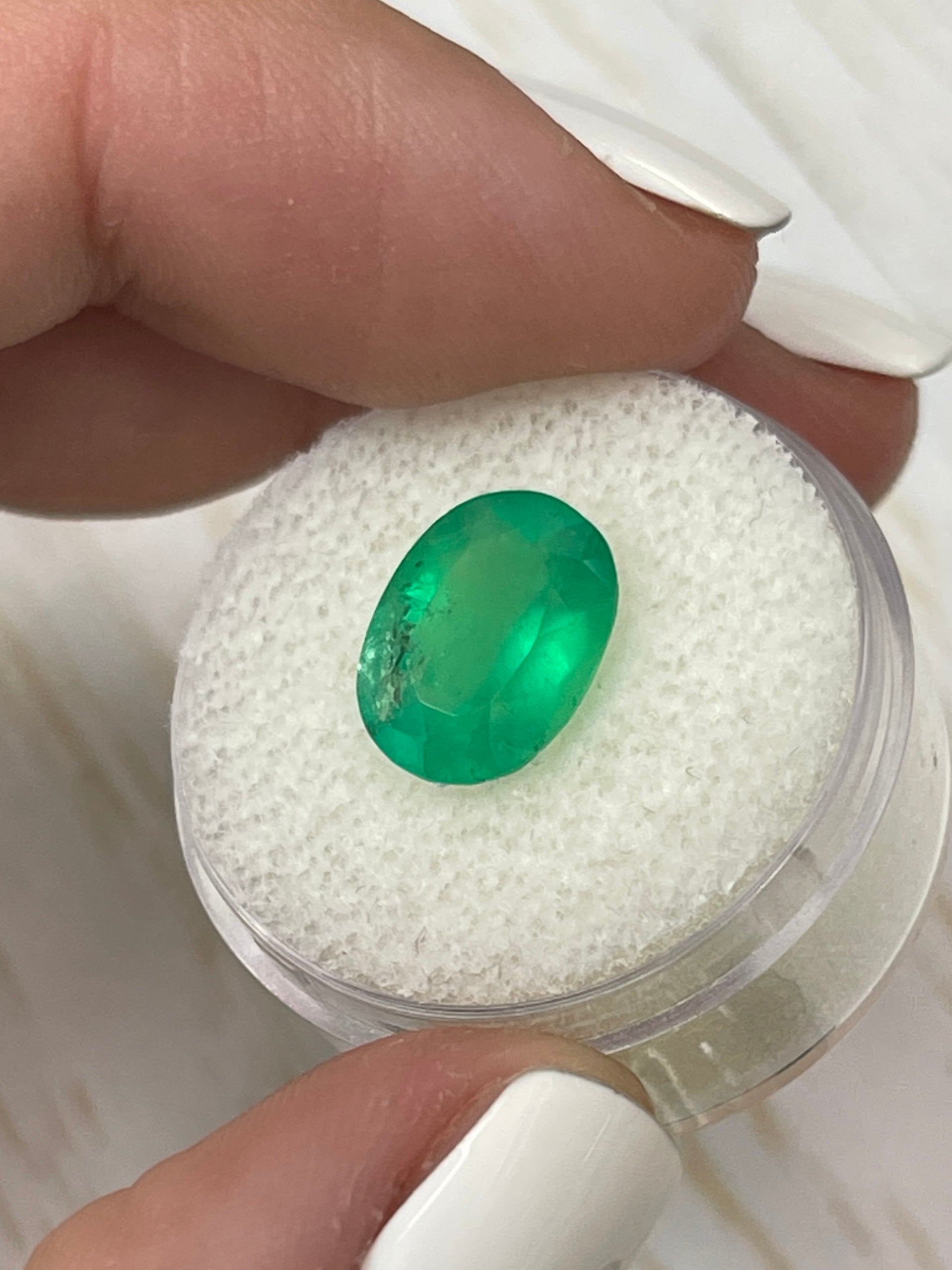 3.46 carat neon green natural Colombian emerald loose oval cut gemstone from JR Colombian Emeralds.