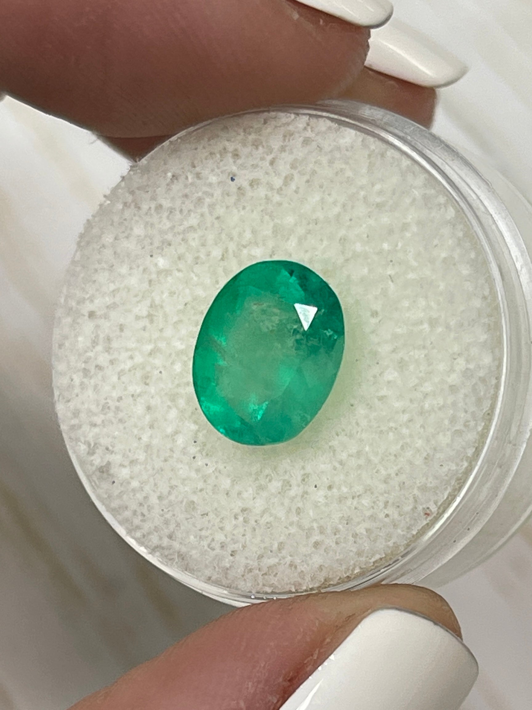 3.48 carat semi-transparent green Colombian emerald loose oval cut gemstone from JR Colombian Emeralds
