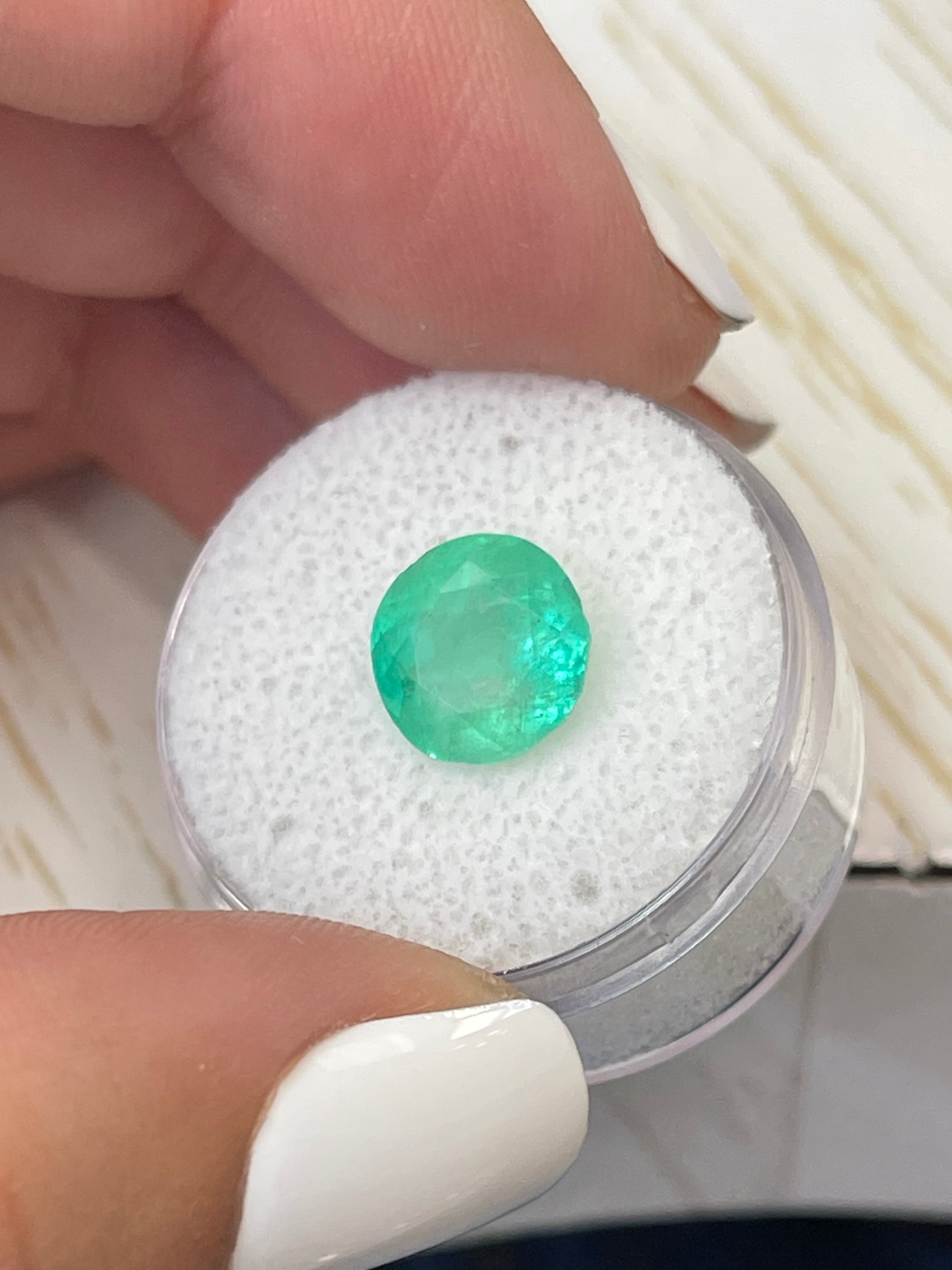 Natural 3.65 carat round Colombian emerald loose gemstone with vibrant green color, 9.7x9.7mm, from JR Colombian Emeralds.