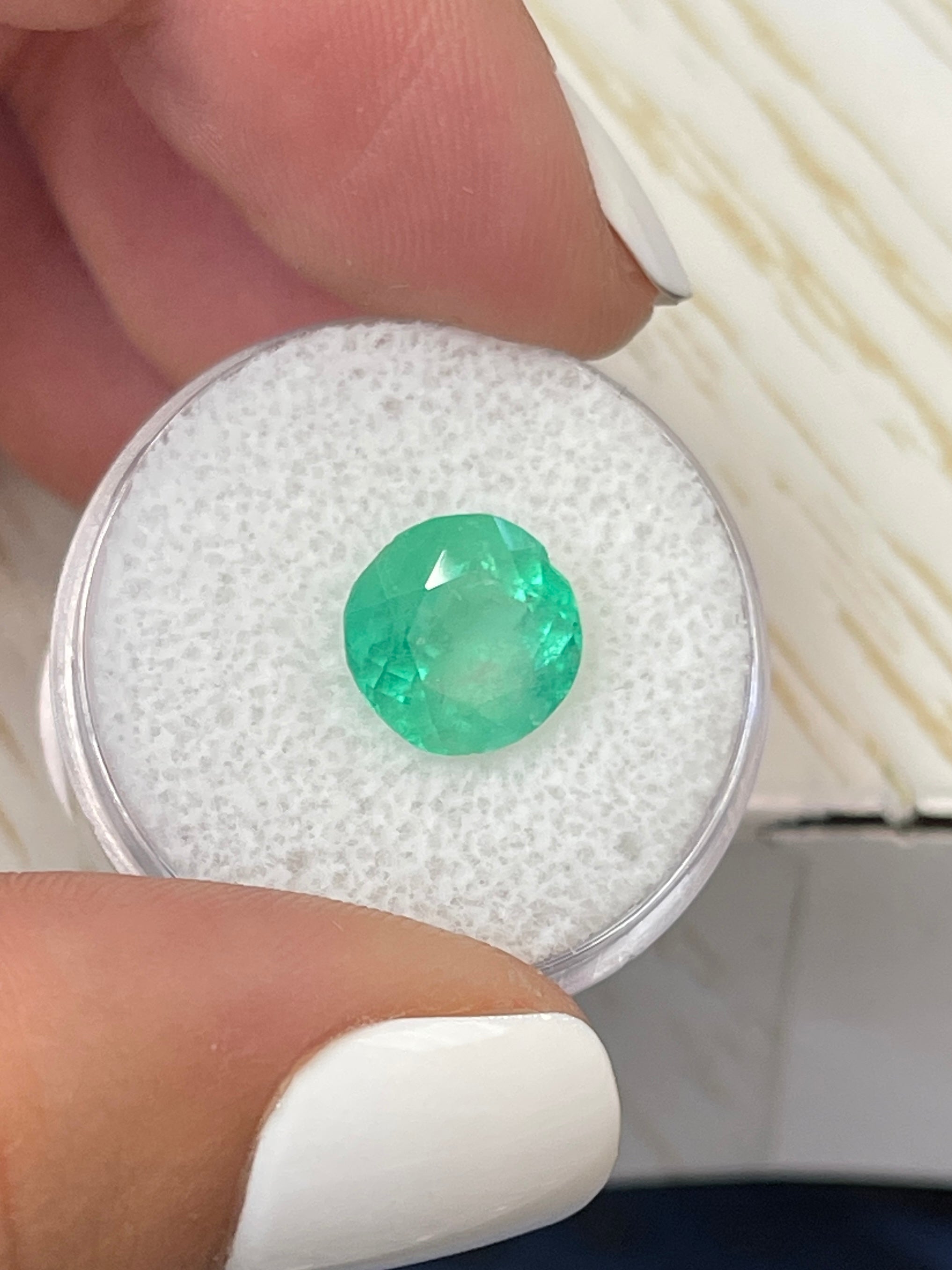 3.65 carat natural round Colombian emerald with vibrant green color and 9.7x9.7mm size, loose gemstone from JR Colombian Emeralds.