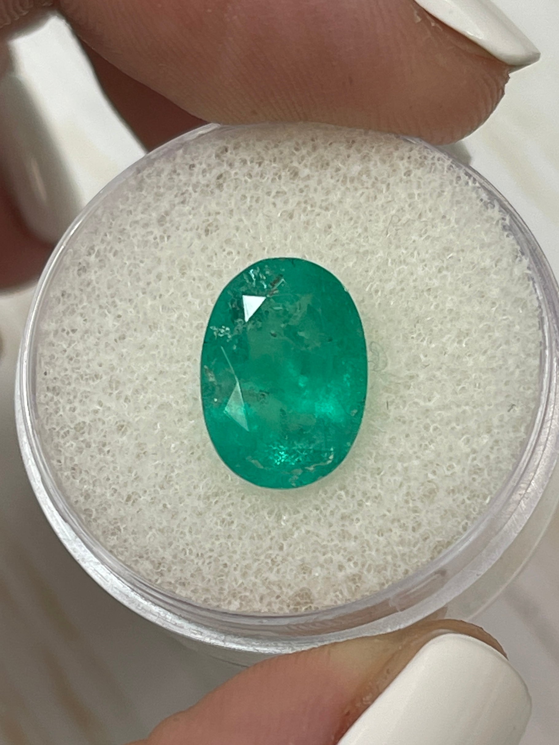 Natural 3.72 Carat Colombian Emerald in oval cut, earthy tone, loose gemstone from JR Colombian Emeralds.