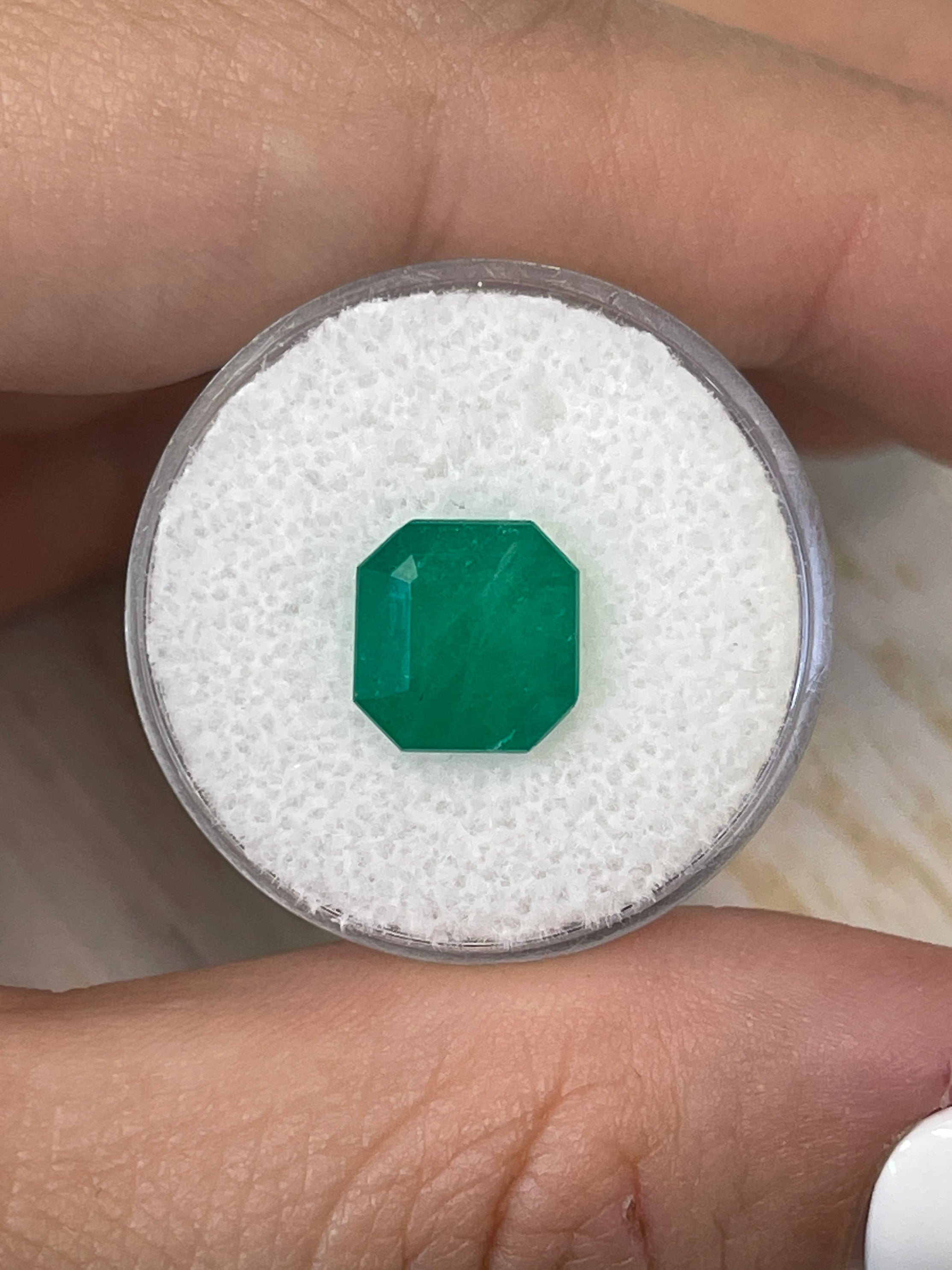 Forest green Colombian emerald Asscher cut with clipped corners, 3.74 carats from JR Colombian Emeralds, with detailed facets and vibrant color.