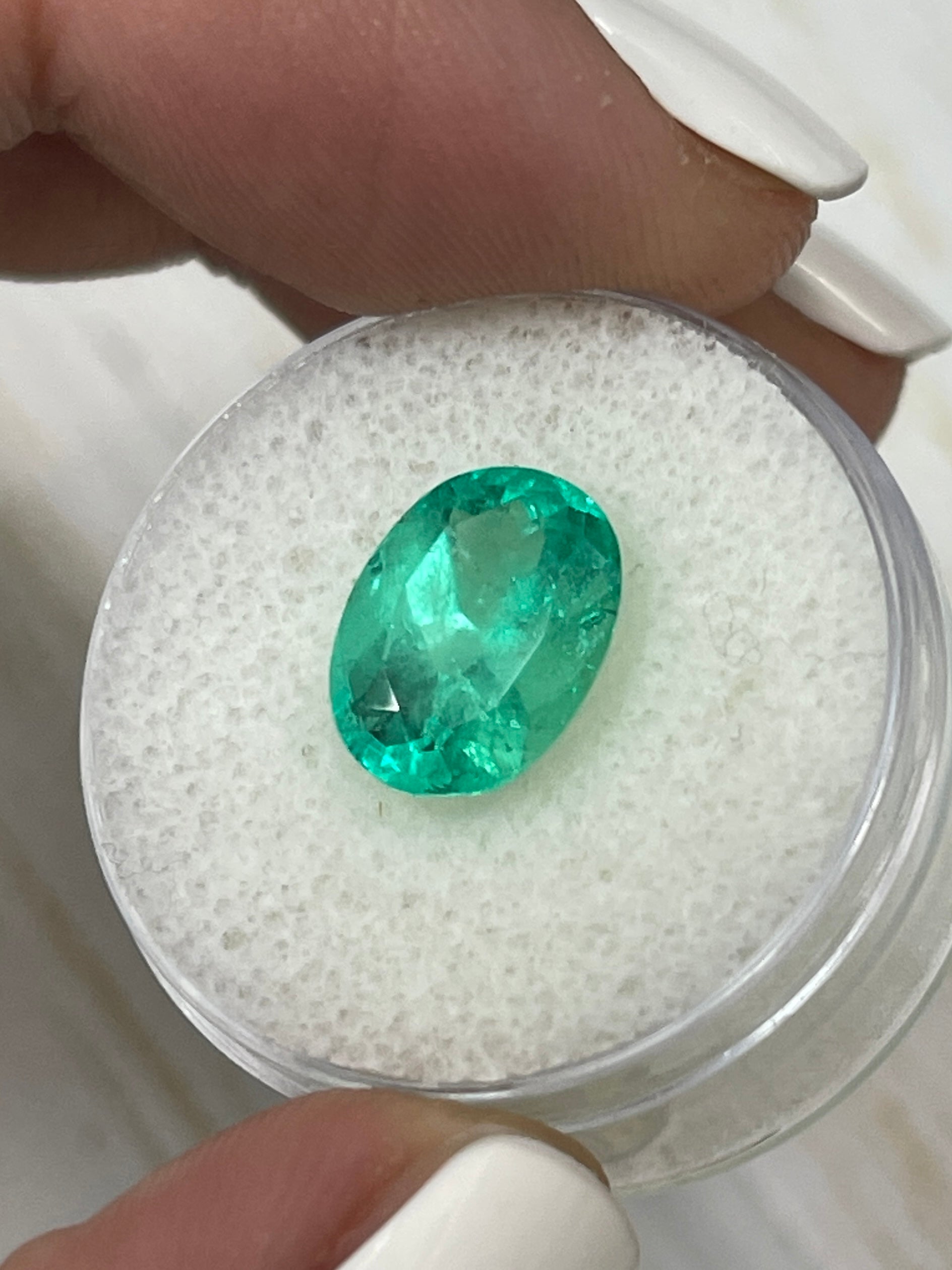 Vibrant spring green 3.86 carat natural Colombian emerald loose oval cut gemstone by JR Colombian Emeralds.