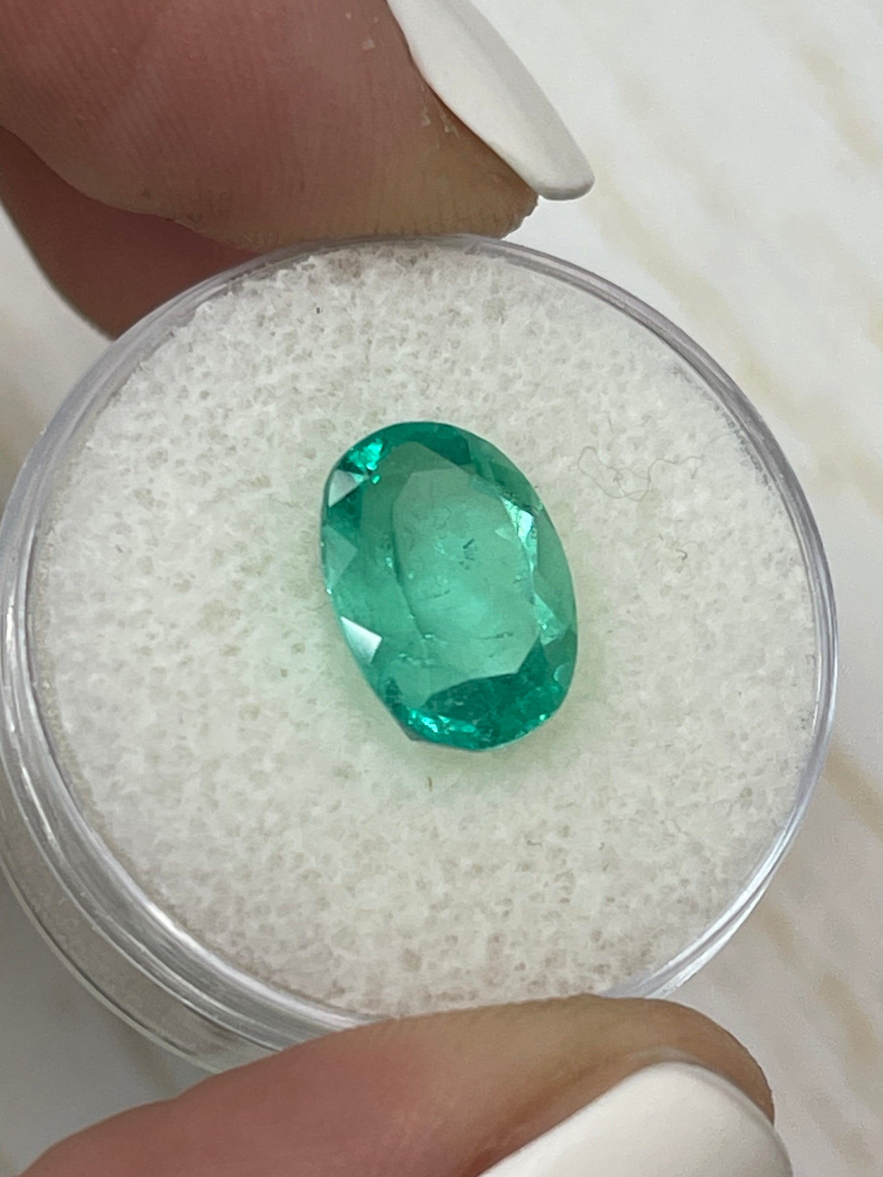 Vibrant 3.86 Carat spring green Colombian emerald loose oval-cut gemstone from JR Colombian Emeralds.