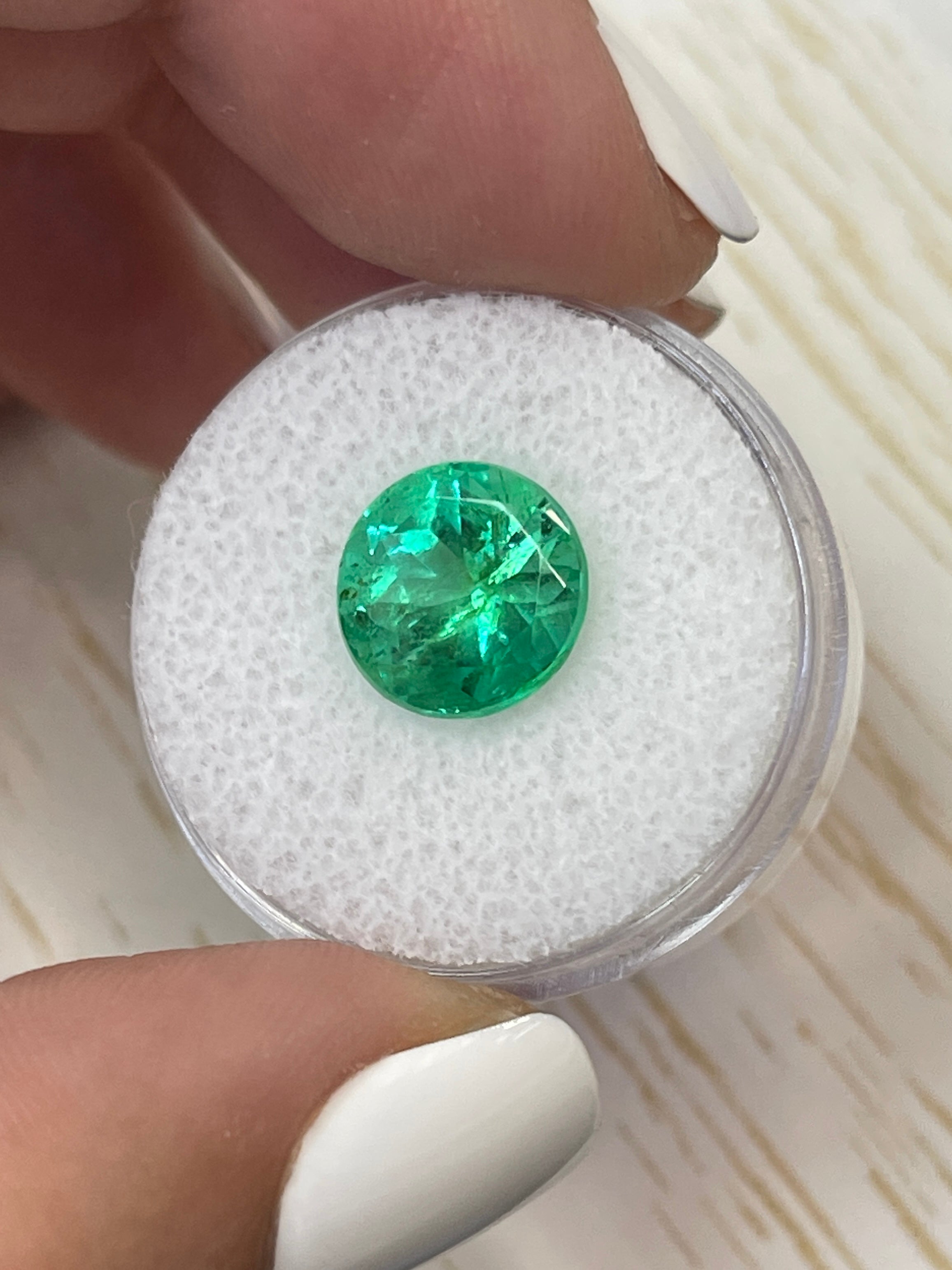 4.14 carat round Colombian emerald gemstone with vibrant green color, natural and loose, from JR Colombian Emeralds.