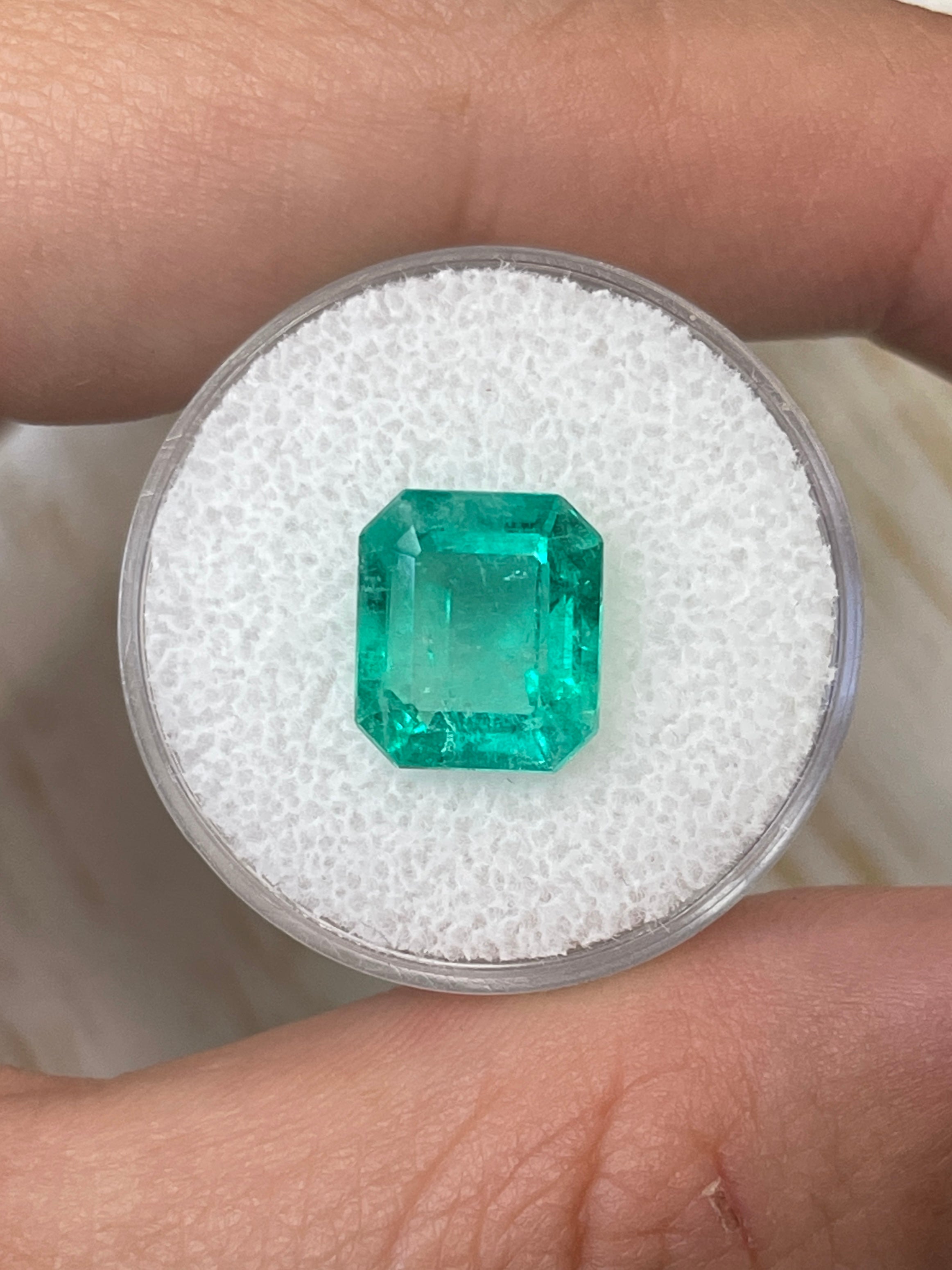 4.17 carat bluish green natural Colombian emerald loose gemstone in classic emerald cut, showcasing vibrant color and clarity.