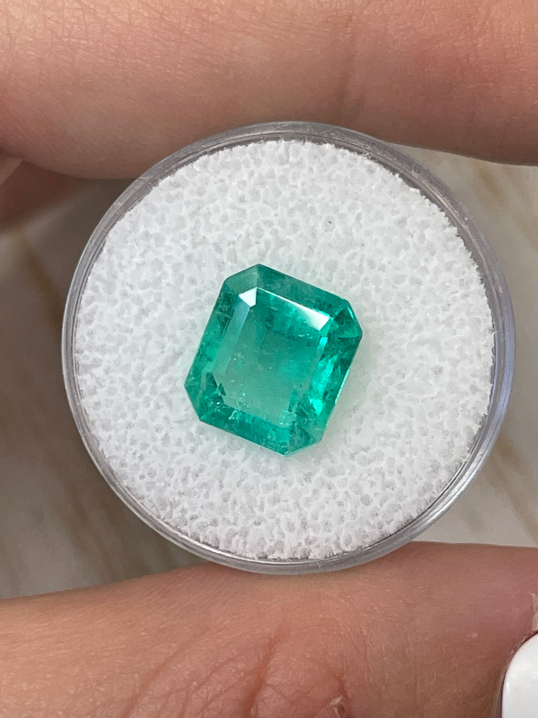 4.17 carat bluish green Colombian emerald loose gemstone in classic emerald cut, natural and faceted by JR Colombian Emeralds.