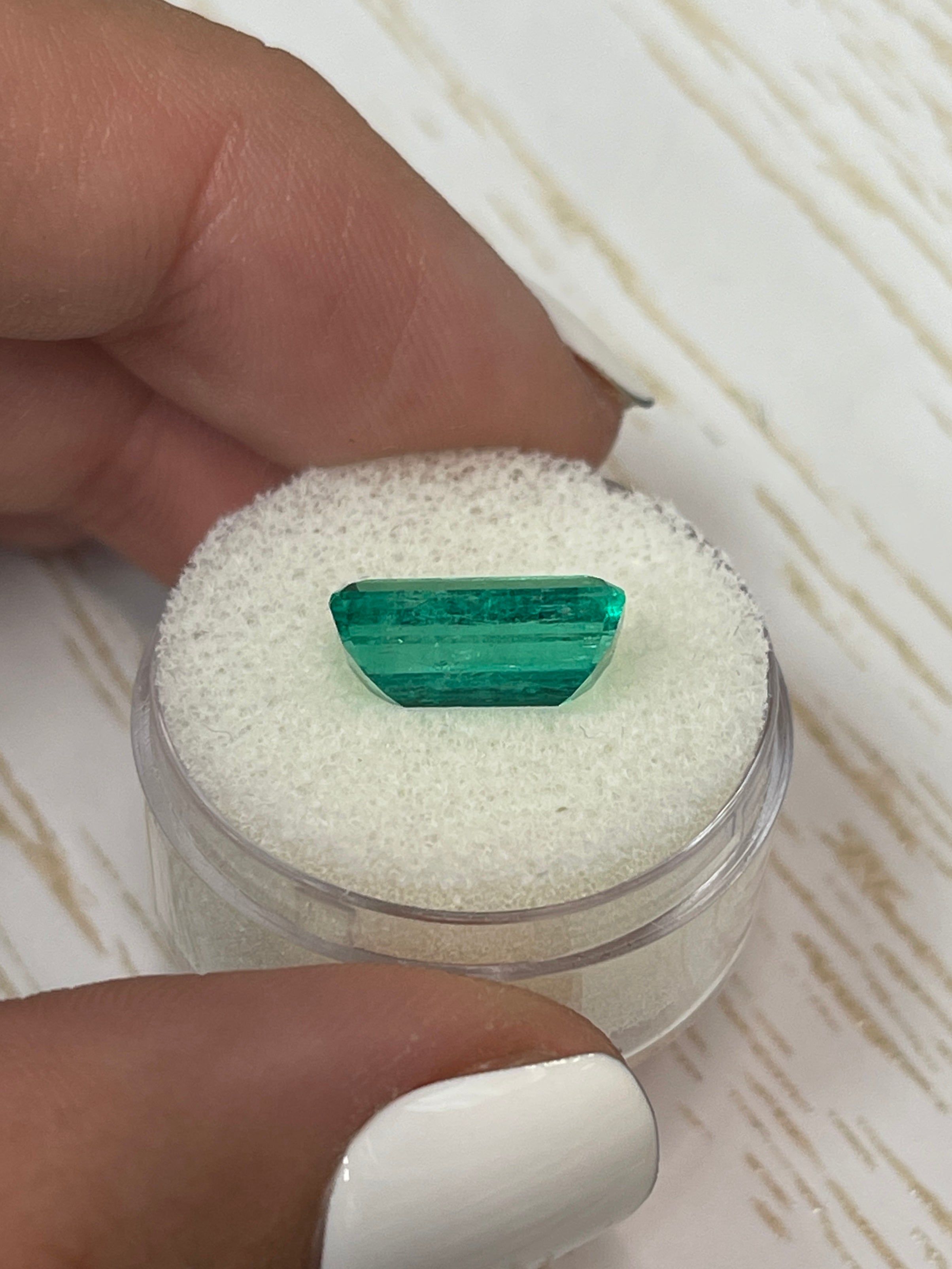 Vivid bluish green 4.26 carat Colombian emerald loose with elongated emerald cut, natural gemstone from JR Colombian Emeralds.