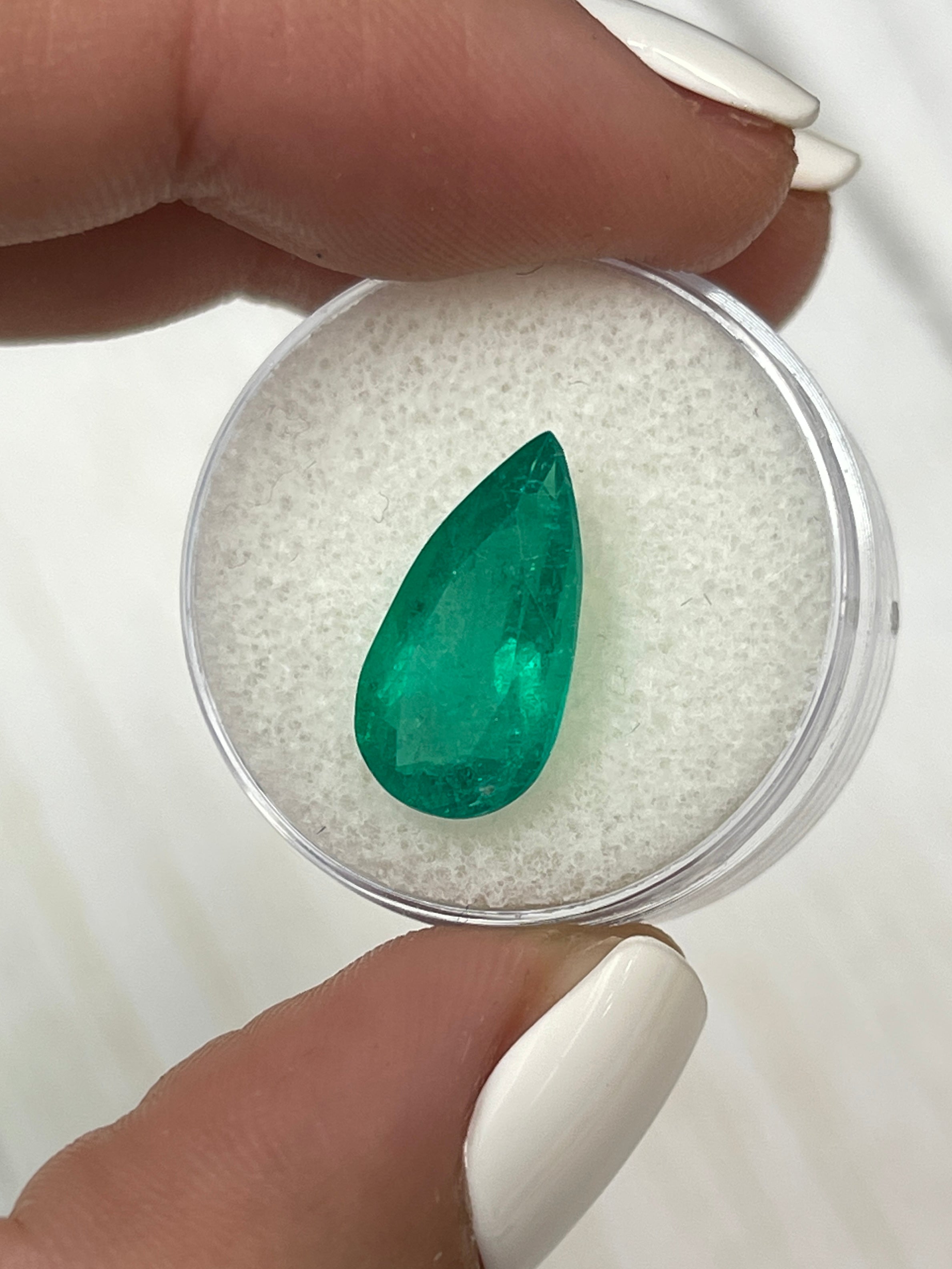 Natural 4.34 carat Colombian emerald loose gemstone in pear cut with rich green color, from JR Colombian Emeralds.
