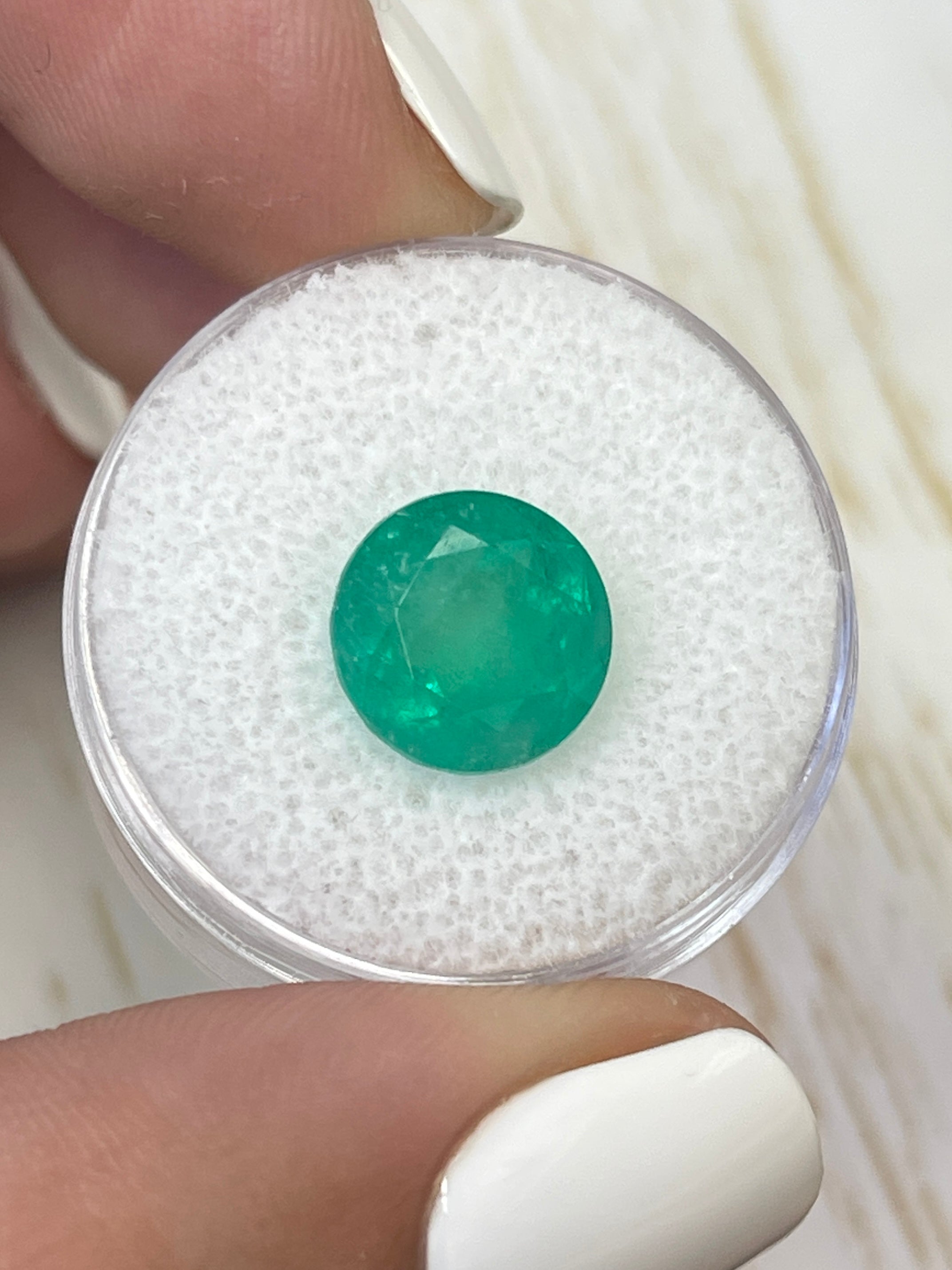 Medium green 4.42 carat round Colombian emerald loose gemstone from JR Colombian Emeralds, natural and faceted for jewelry.