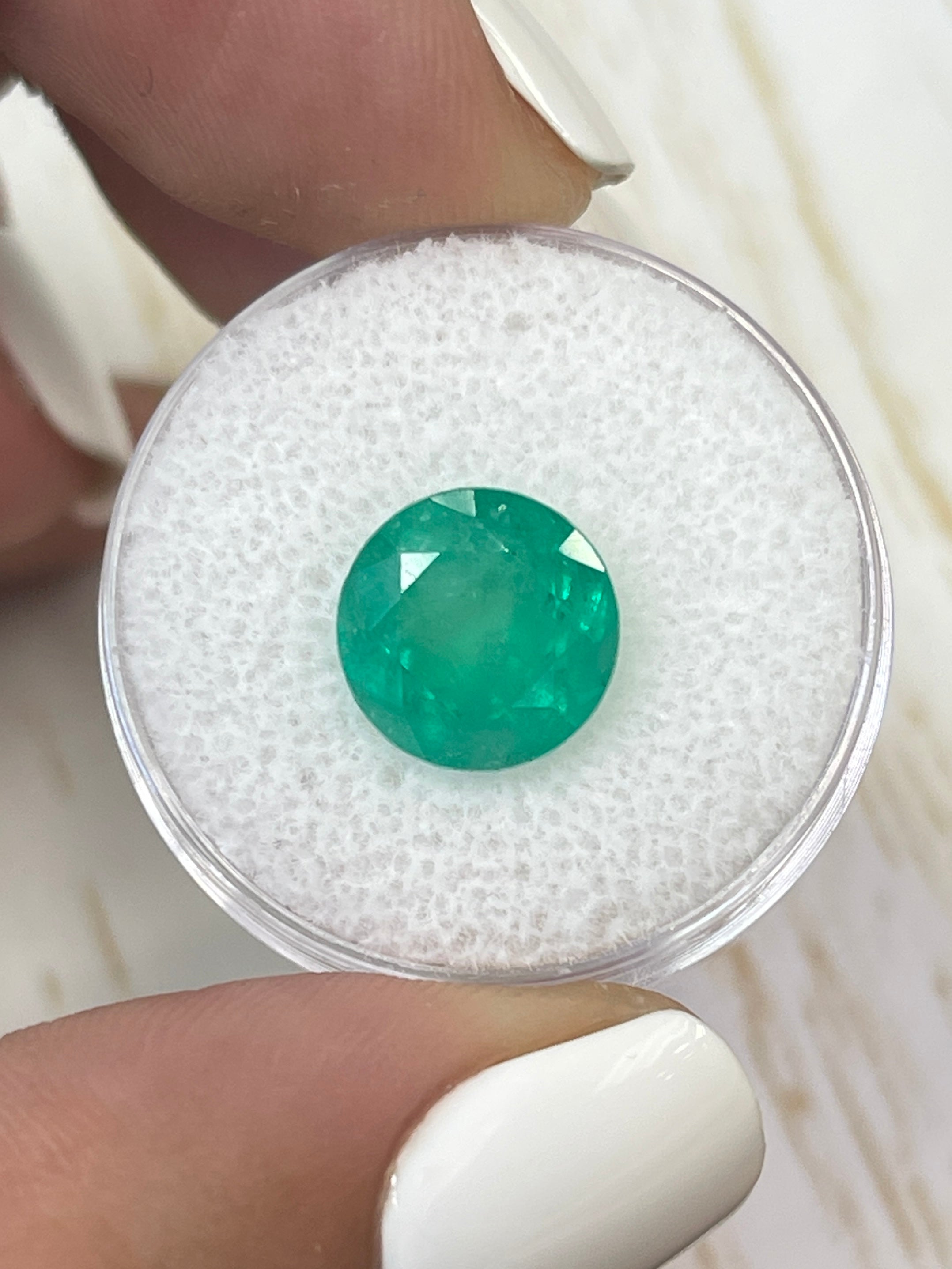 Medium green 4.42 carat round Colombian emerald loose gemstone from JR Colombian Emeralds, showcasing natural color and clarity.