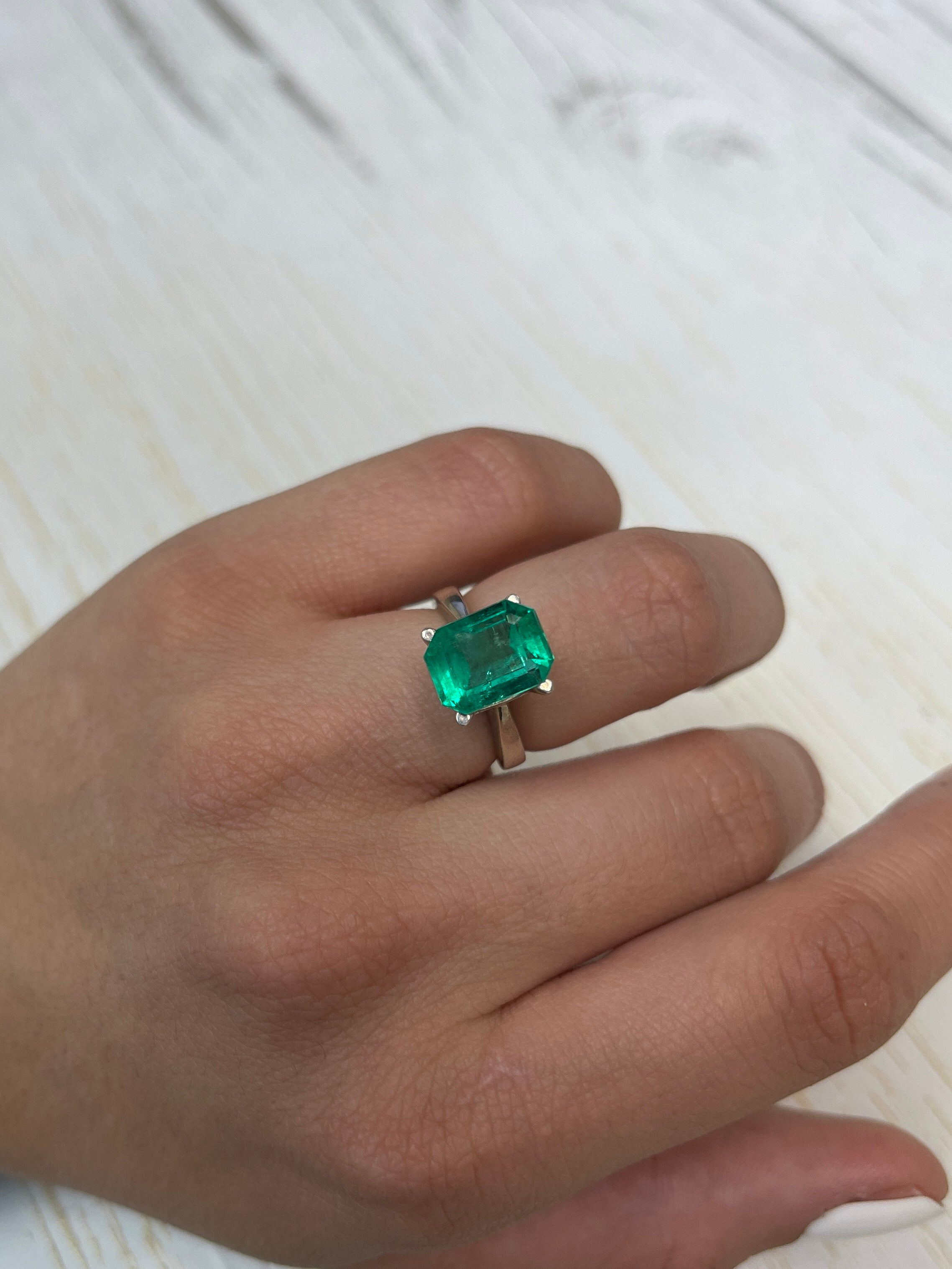 4.64 carat natural Colombian emerald loose gemstone with 11x9 emerald cut, vibrant bluish green color, by JR Colombian Emeralds