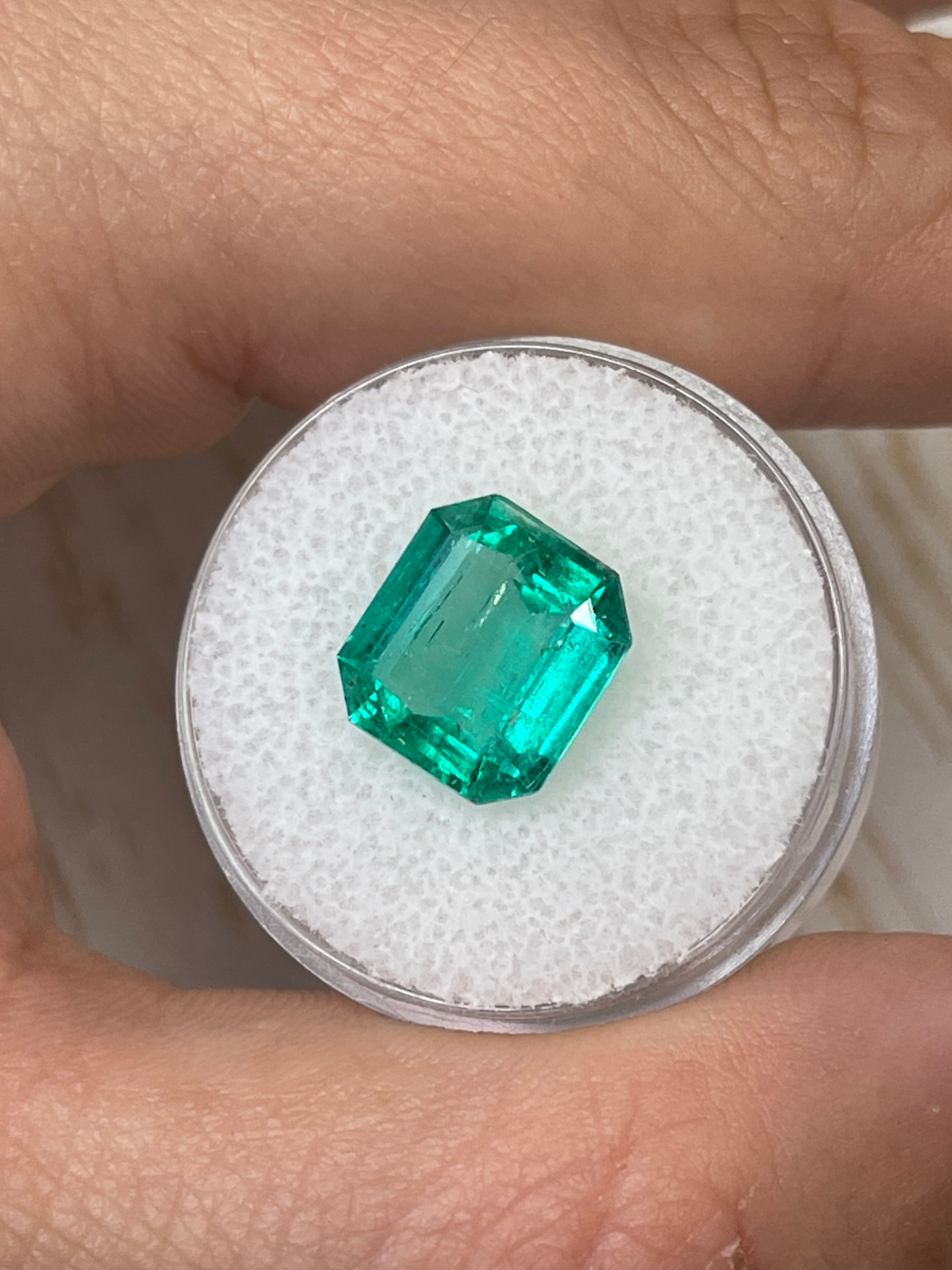 Natural 4.72 carat bluish Colombian emerald loose Asscher cut from JR Colombian Emeralds, showcasing its vibrant color and clarity.