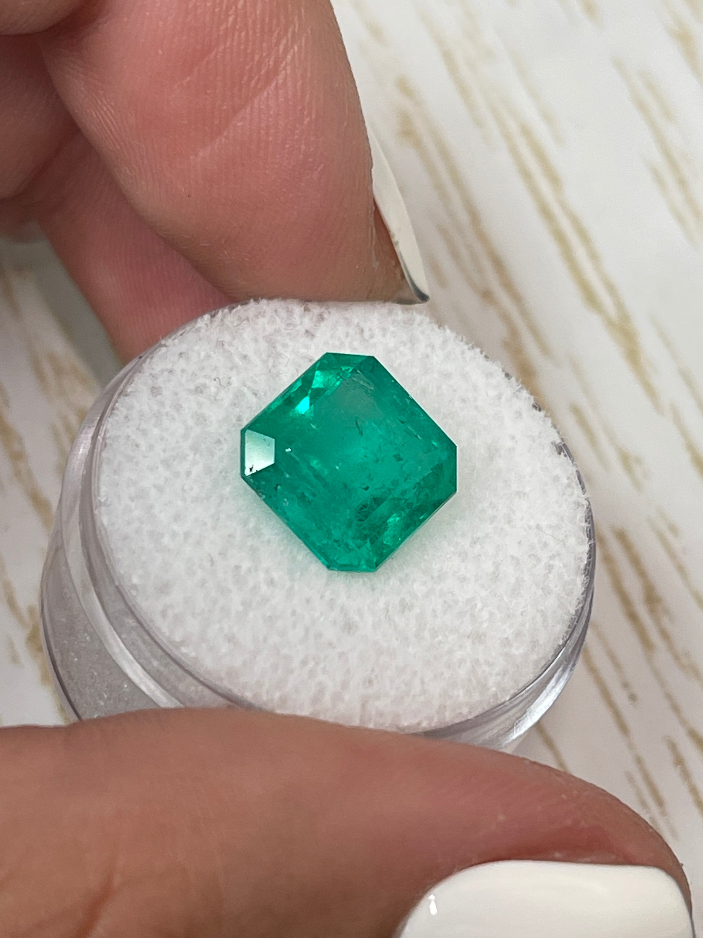 Deep bluish green 4.75 carat natural Colombian emerald in Asscher cut, loose gemstone with minor oil treatment by JR Colombian Emeralds.