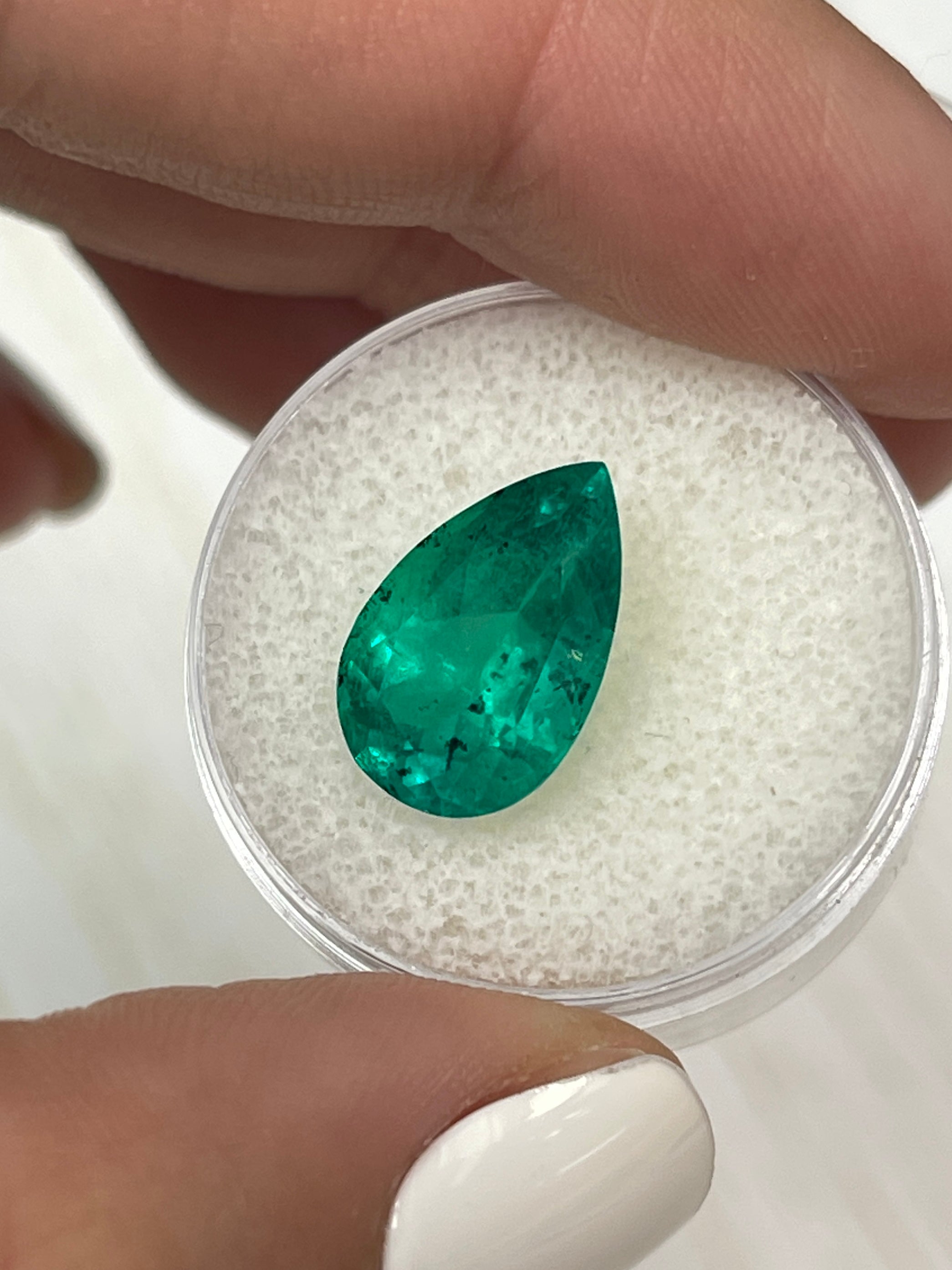 Freckled 5.18 Carat Colombian Emerald in pear cut, natural loose gemstone, 14.5x9mm from JR Colombian Emeralds.