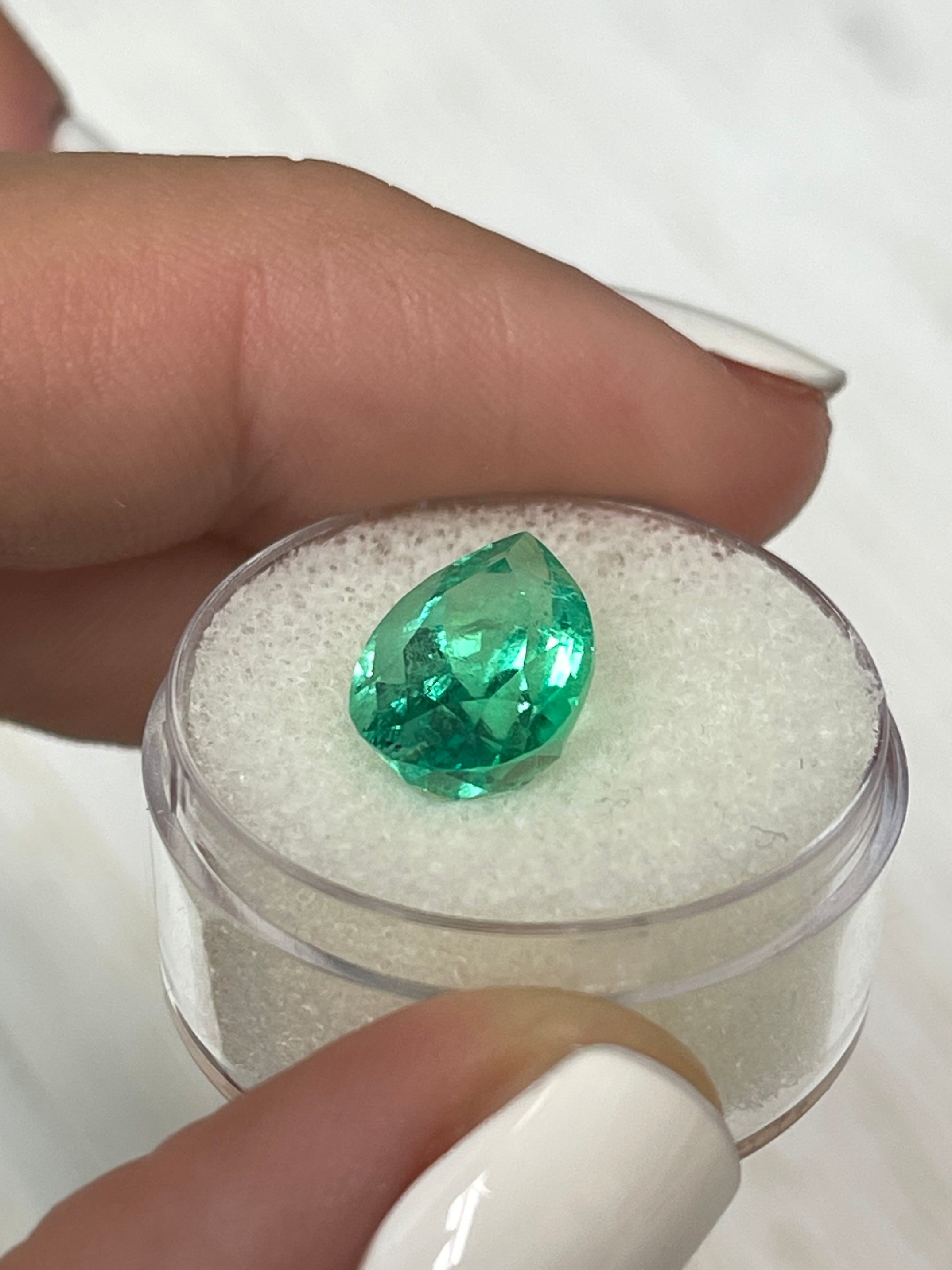 Vivid 5.21 carat natural Colombian emerald in pear cut, measuring 14.3x9 mm, from JR Colombian Emeralds.