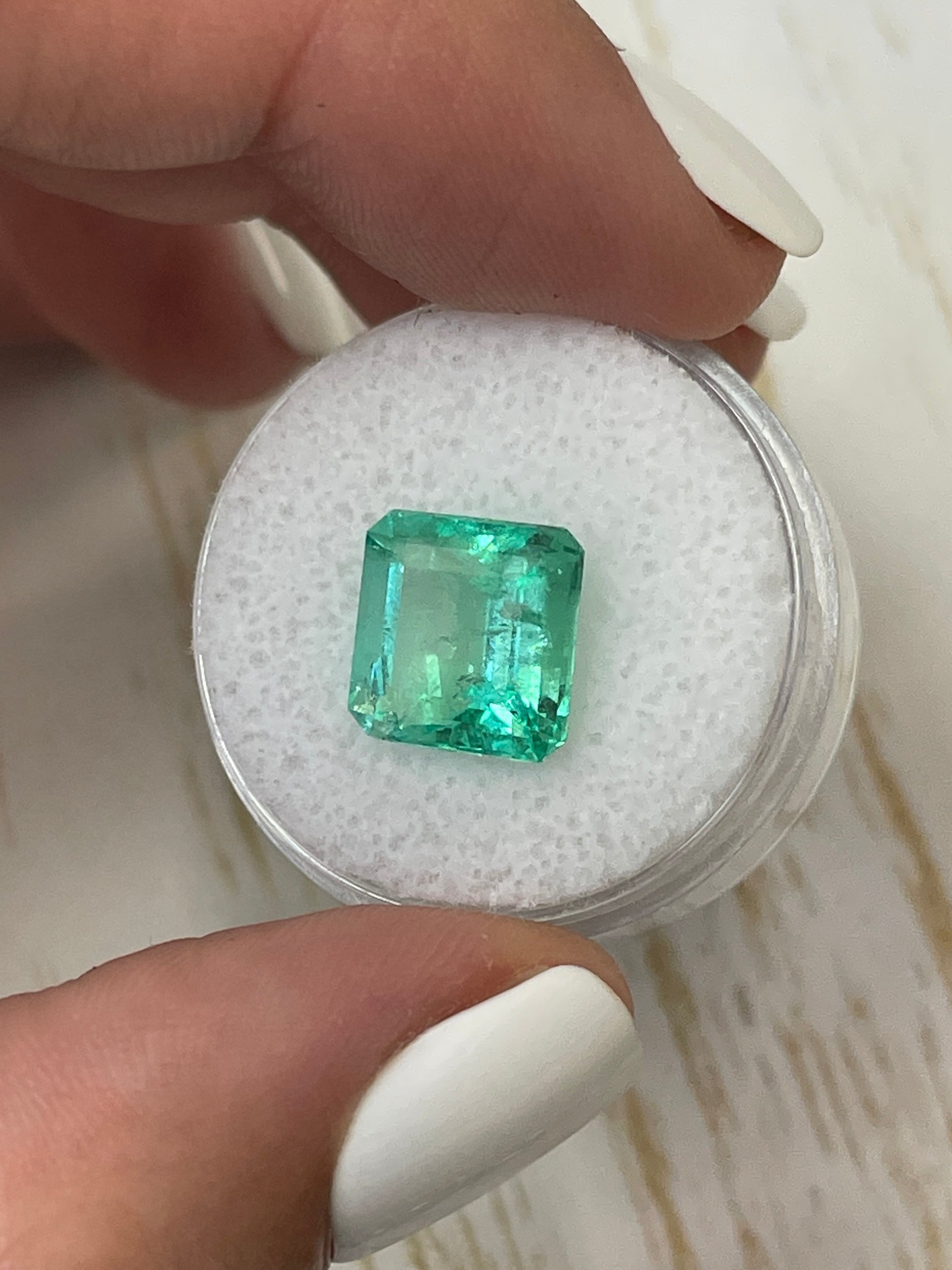 Loose 5.32 carat green Colombian Emerald in Asscher cut, natural and radiant, from JR Colombian Emeralds.