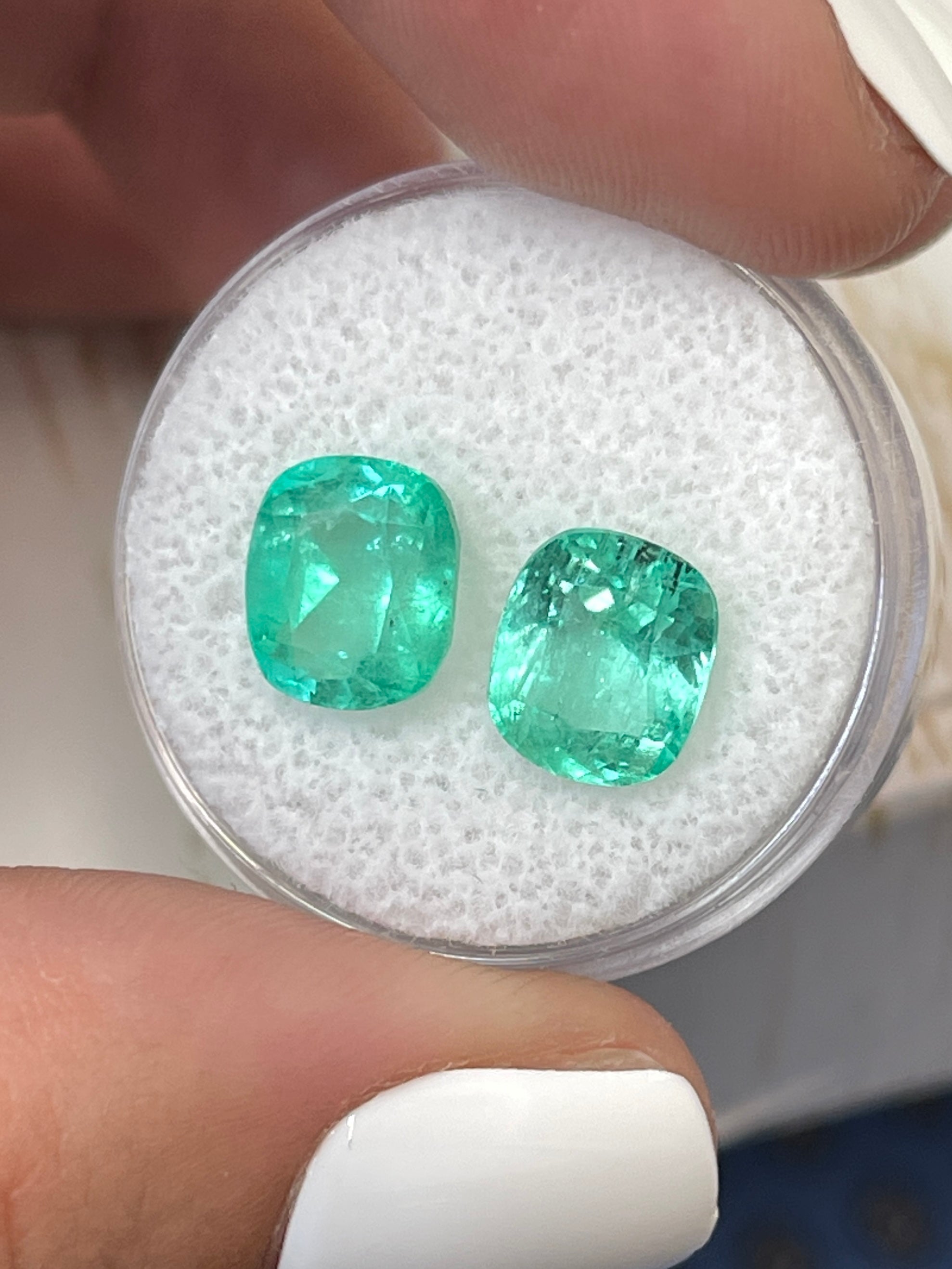 Five 5.61 carat of matching light bluish green Colombian emeralds in cushion cut, natural loose gemstones by JR Colombian Emeralds.