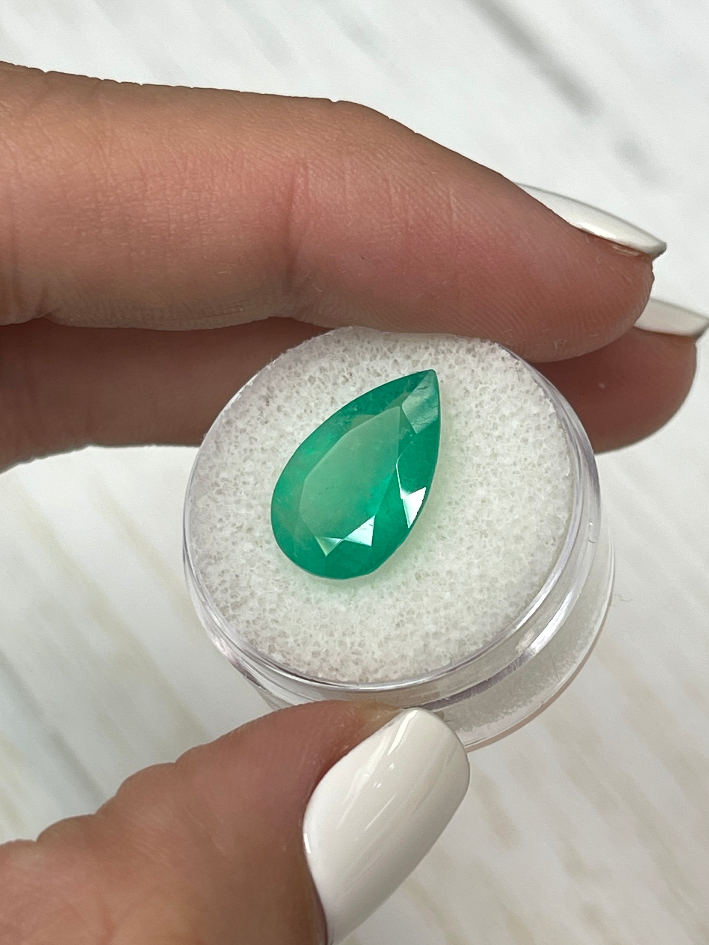 5.63 carat apple green natural Colombian emerald loose with pear cut, from JR Colombian Emeralds.