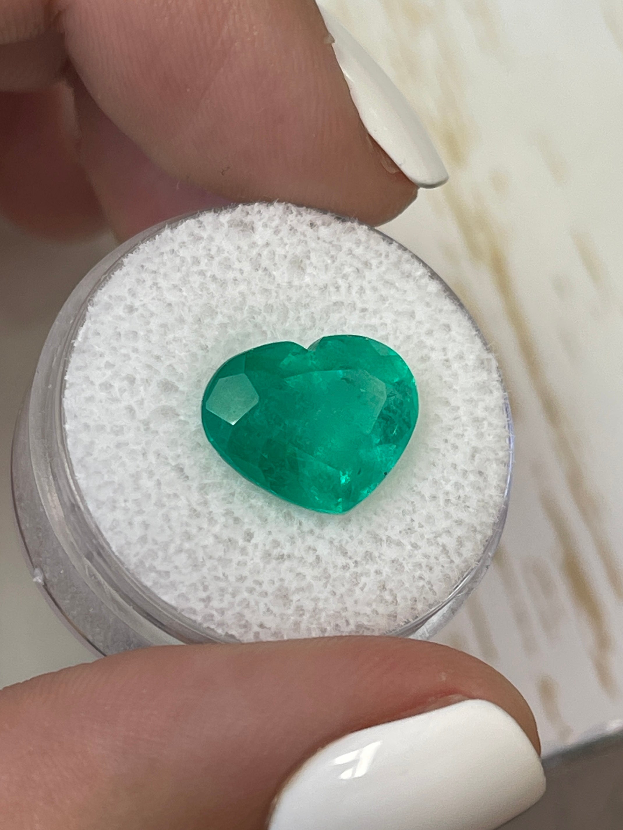 Bright green 5.80 carat natural Colombian emerald in heart cut, loose gemstone from JR Colombian Emeralds.