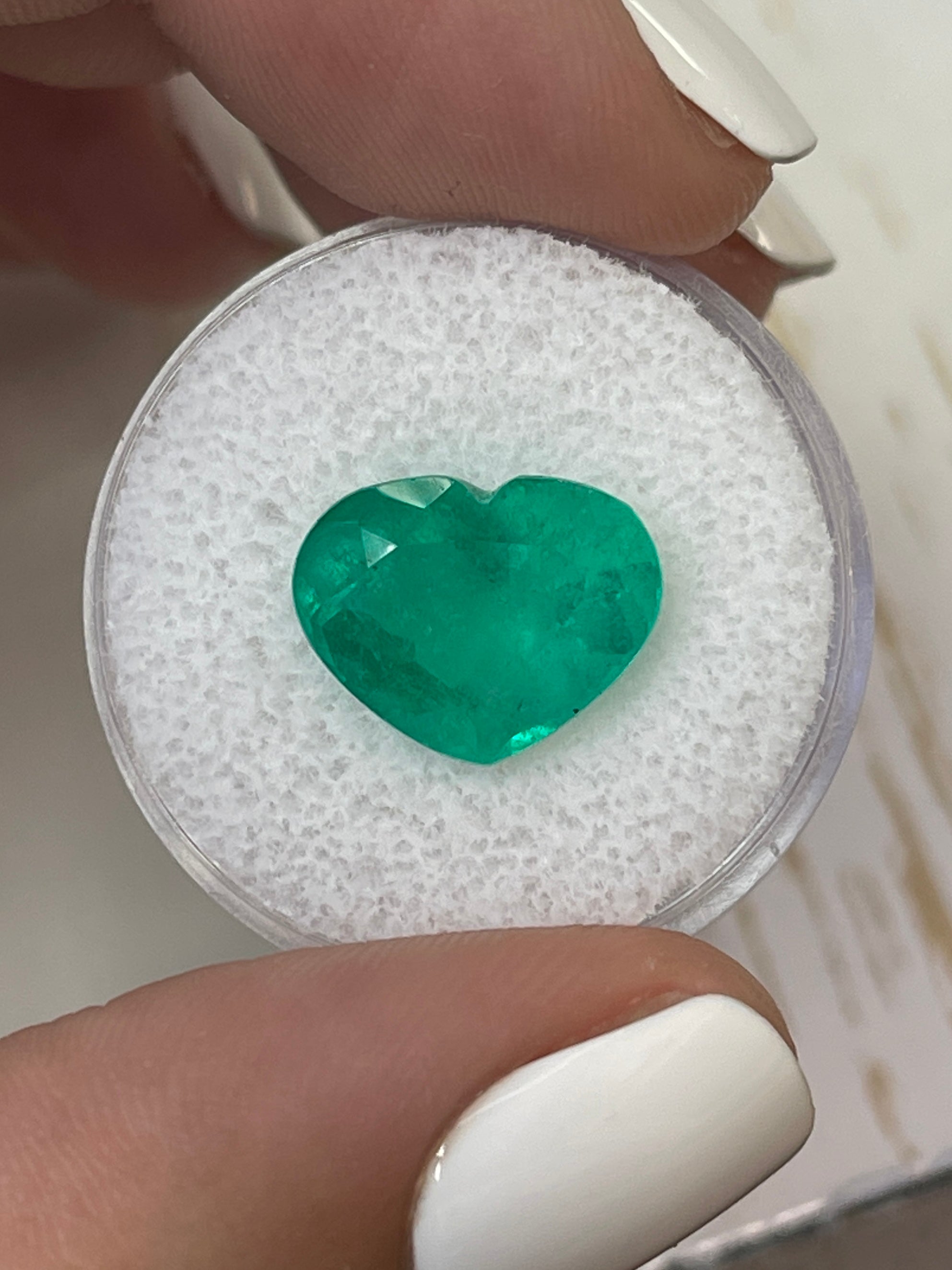 Bright green 5.80 carat natural Colombian emerald in heart cut, loose gemstone from JR Colombian Emeralds.