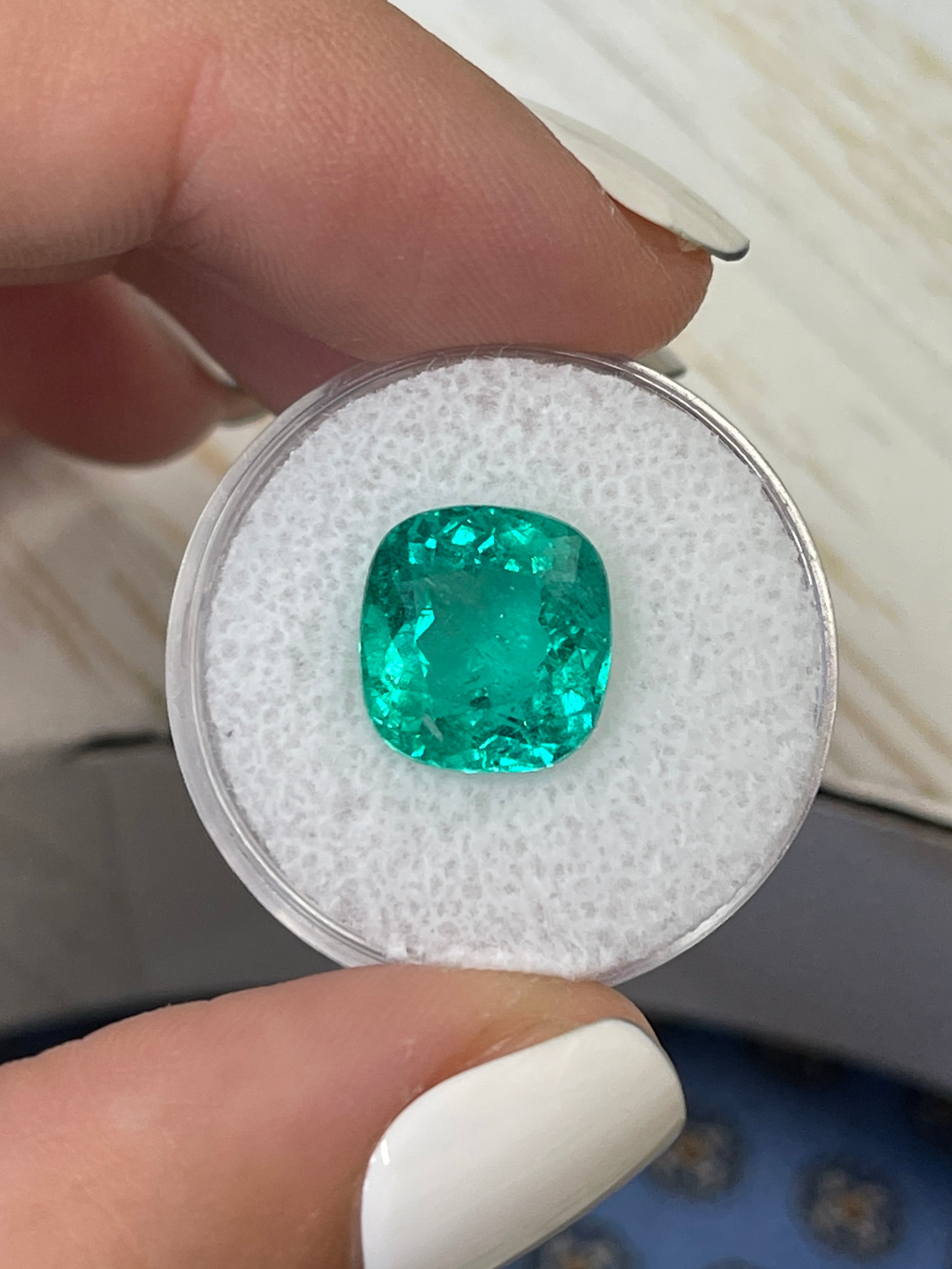 Loose 5.80 carat Colombian emerald, cushion cut, bluish green natural gemstone, from JR Colombian Emeralds.