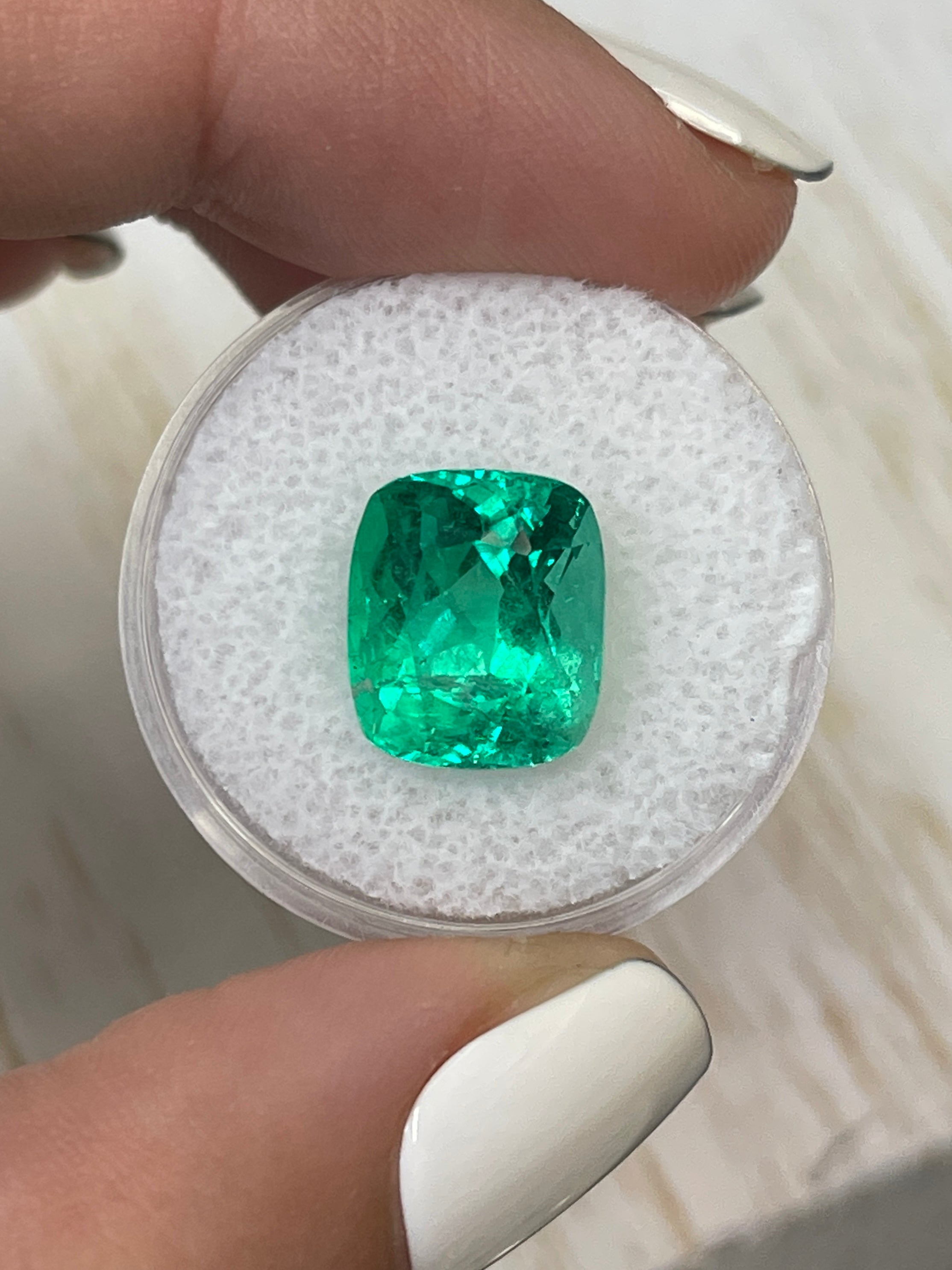 Natural 6.17 carat Colombian emerald loose gemstone with cushion cut, intense green color, minor to moderate oil treatment by JR Colombian Emeralds