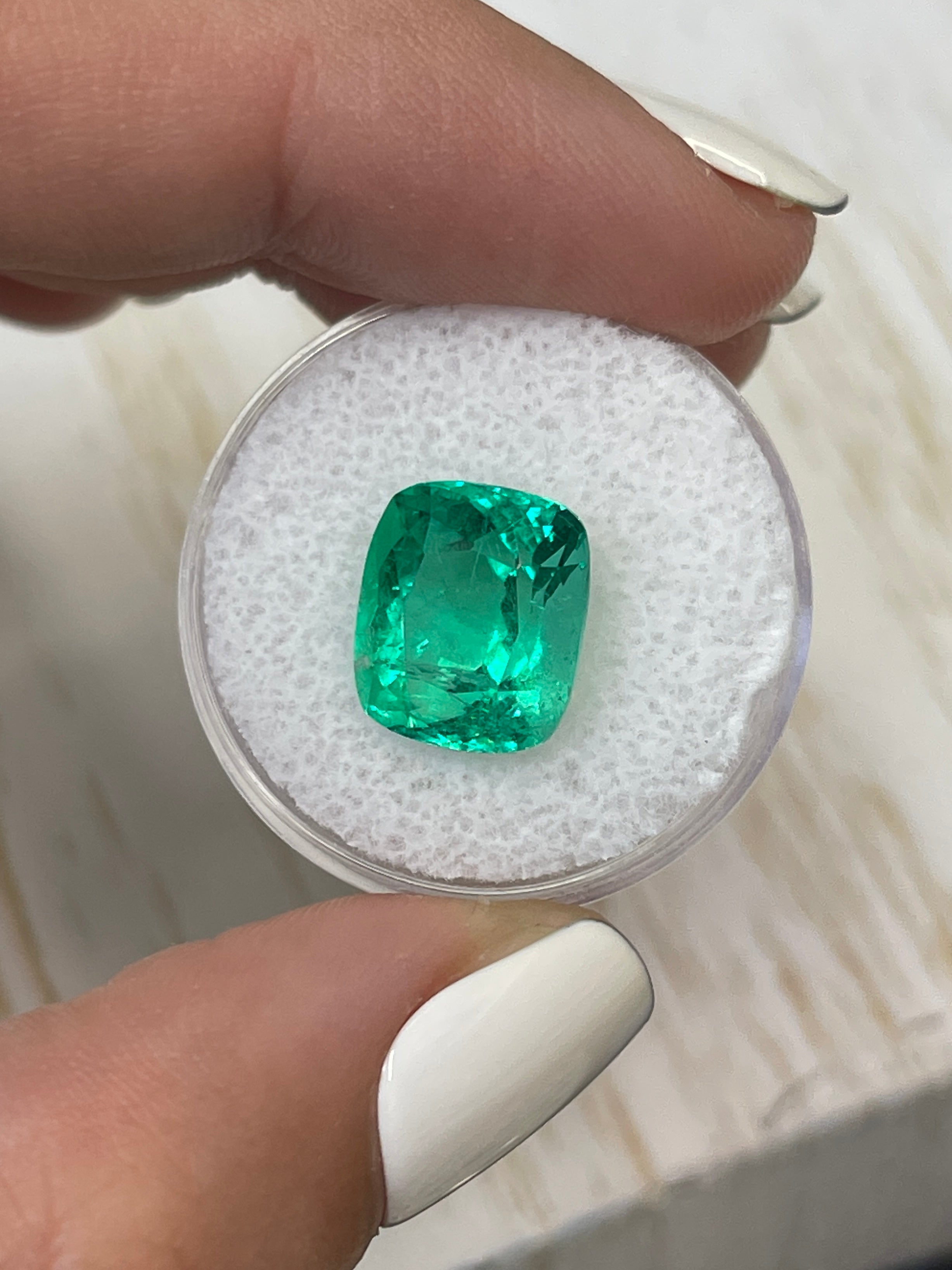 Cushion cut 6.17 carat intense green Colombian emerald loose gemstone with minor to moderate oil treatment, from JR Colombian Emeralds