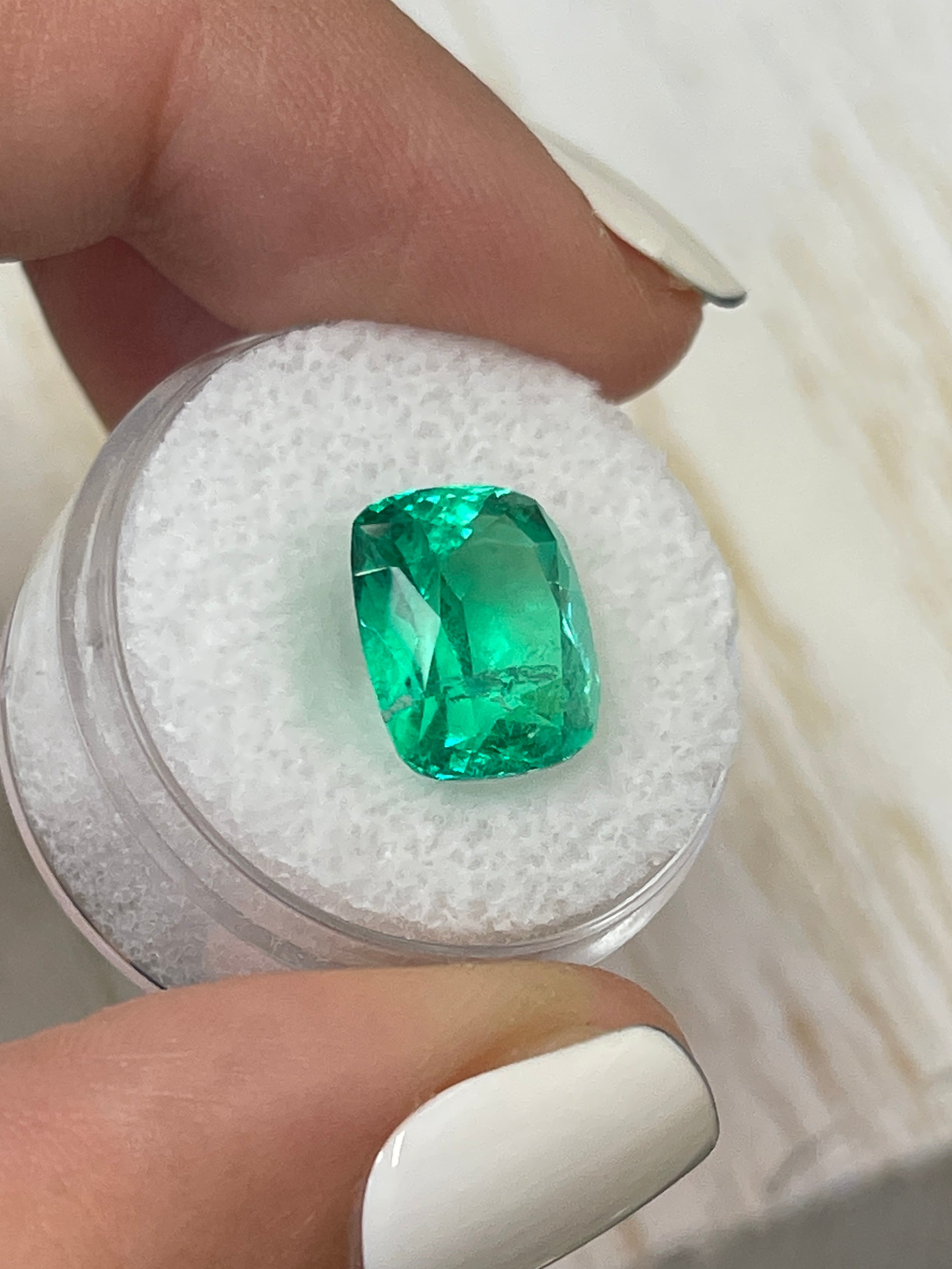 Cushion-cut 6.17 carat intense green Colombian emerald loose gemstone with minor to moderate oil inclusion, from JR Colombian Emeralds.