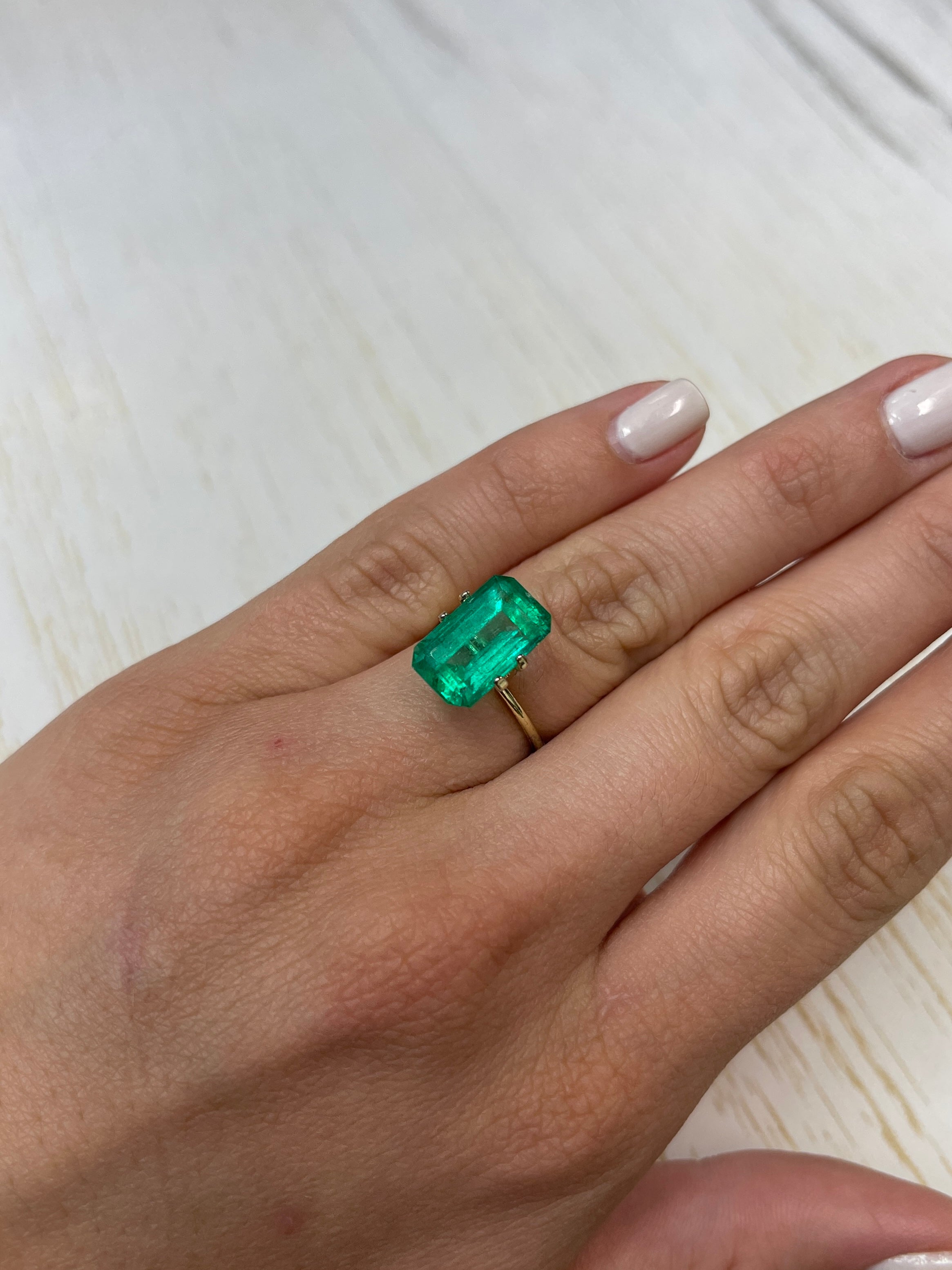 6.22 carat bluish green Colombian emerald cut loose gemstone with vivid color and clarity, from JR Colombian Emeralds.