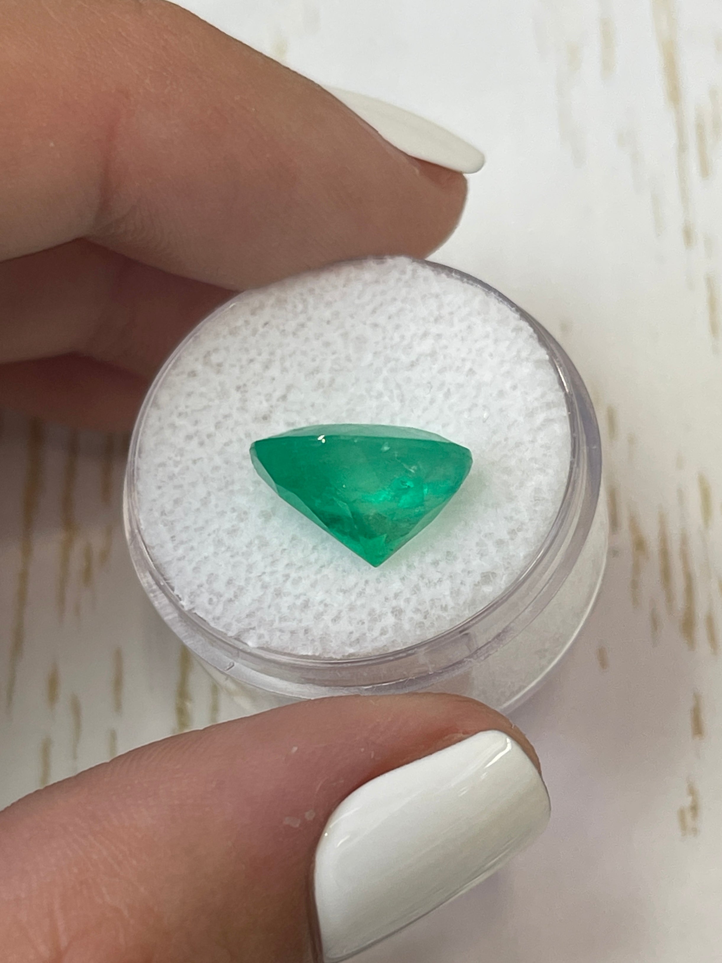 Neon green 6.35-carat natural Colombian emerald, oval cut, loose gemstone with vibrant color and clarity.