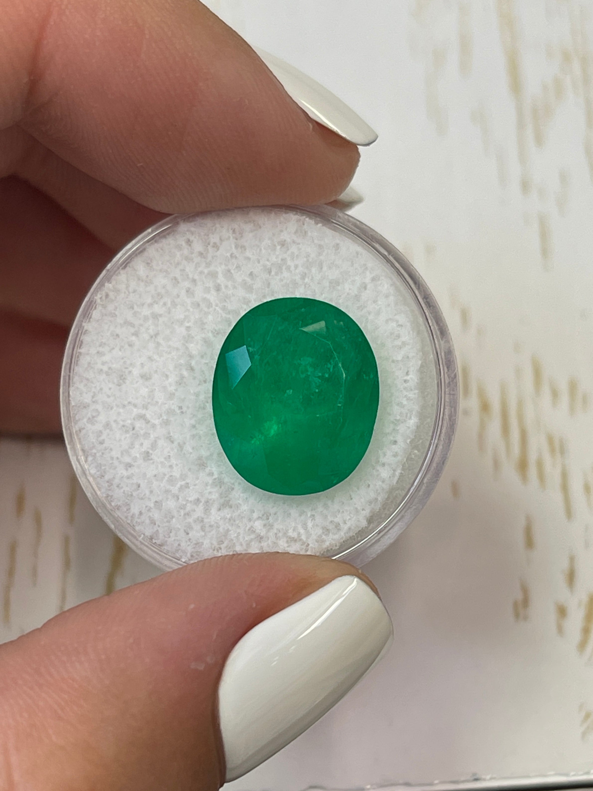 Deep green 8.29 carat Colombian emerald in oval cut, natural loose gemstone from JR Colombian Emeralds.