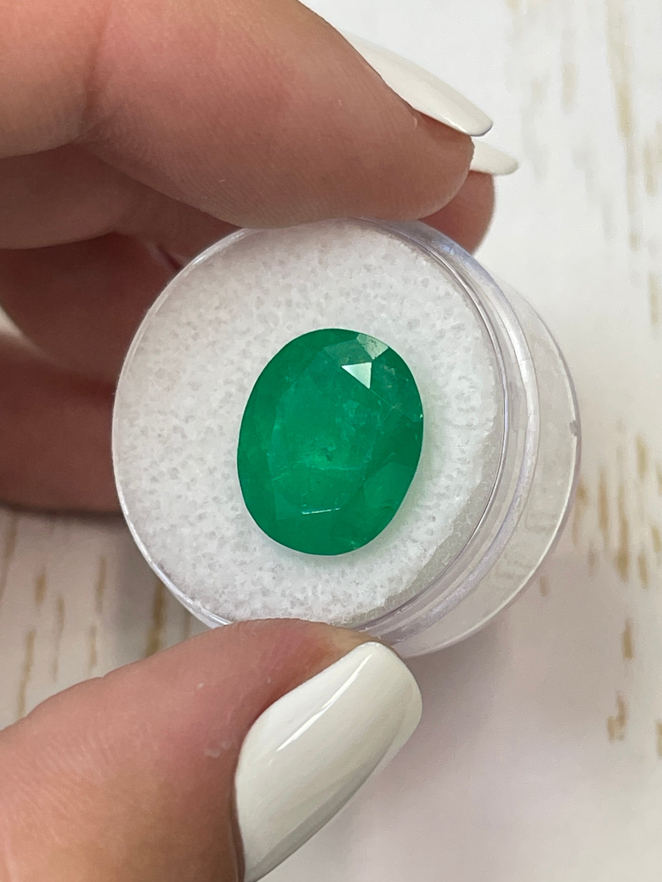 Deep green 8.29 carat natural Colombian emerald in oval cut, loose gemstone from JR Colombian Emeralds.