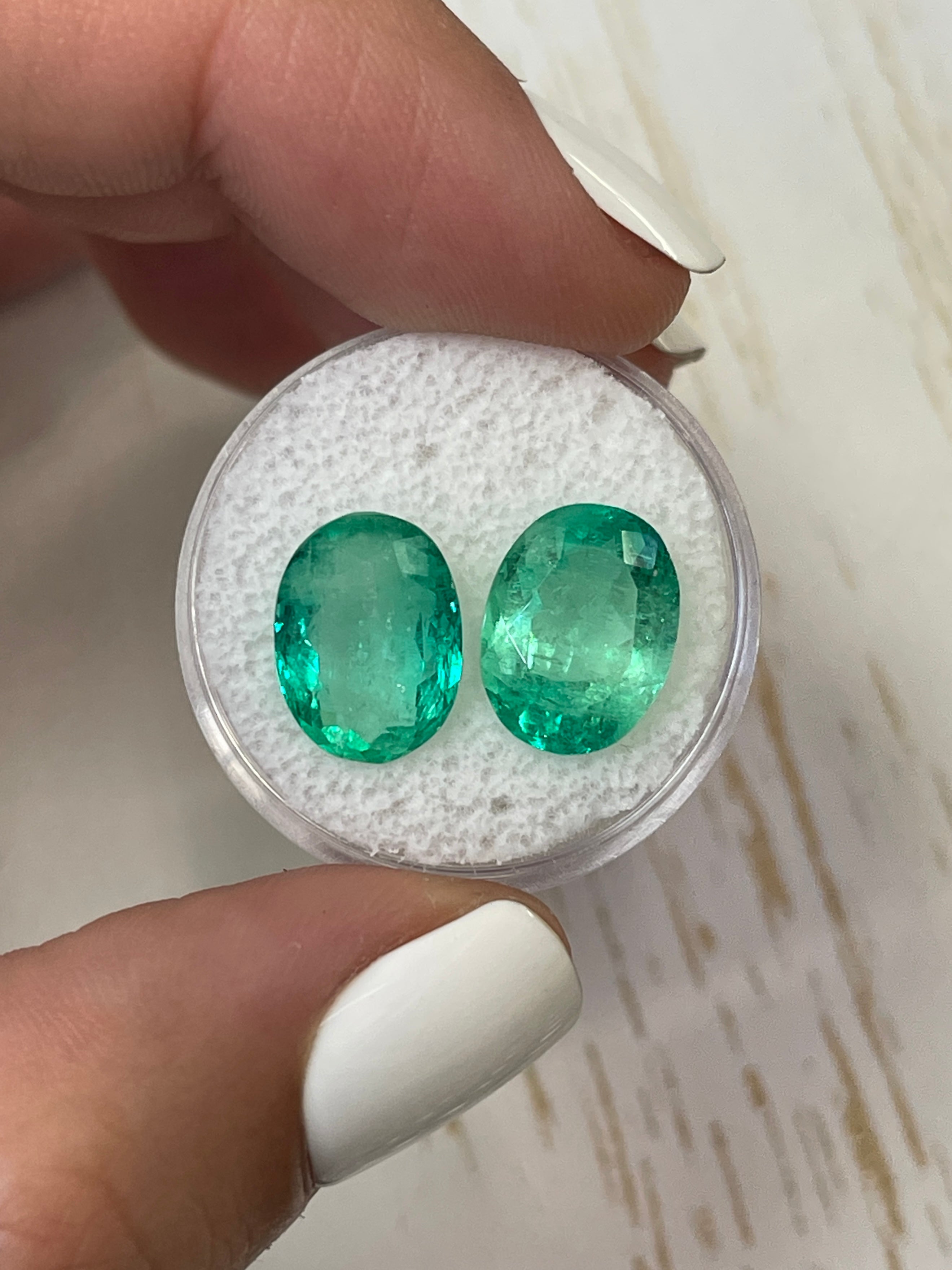Pair of 9.02tcw Colombian emeralds in oval cut, matching loose gemstones from JR Colombian Emeralds.