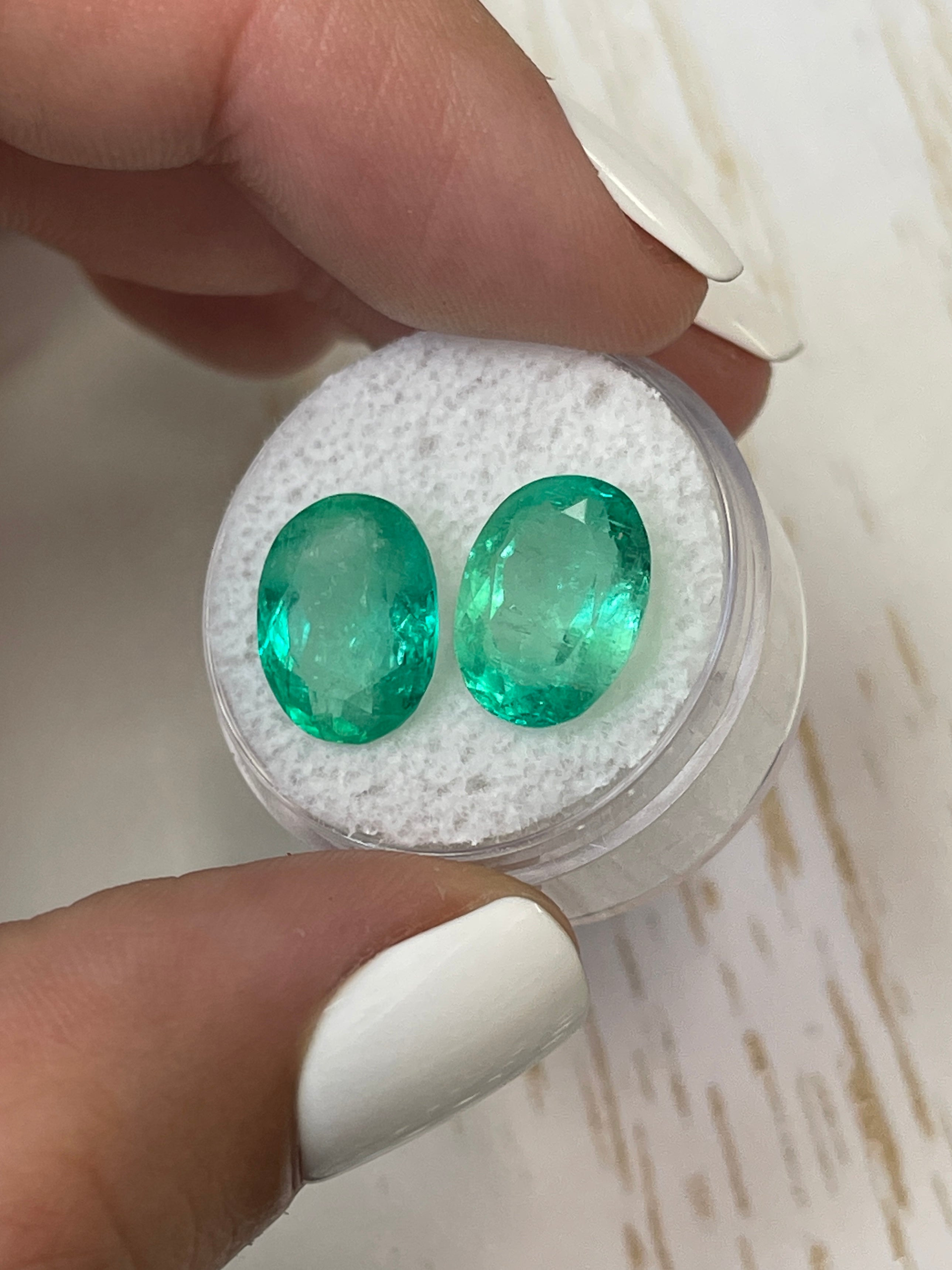 Oval cut Colombian emeralds totaling 9.02 carats, matching loose gemstones with vibrant green color, by JR Colombian Emeralds.